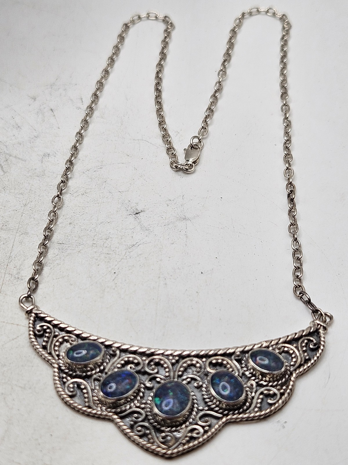 Sterling Silver Bib Style Necklace With 5 Oval Bezel Set Opals. 20″ Marked. 925.