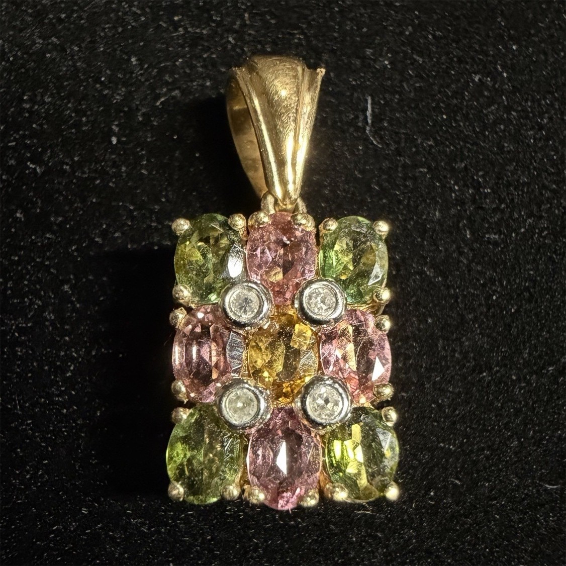 10k gold with diamonds and Tourmaline pendant.