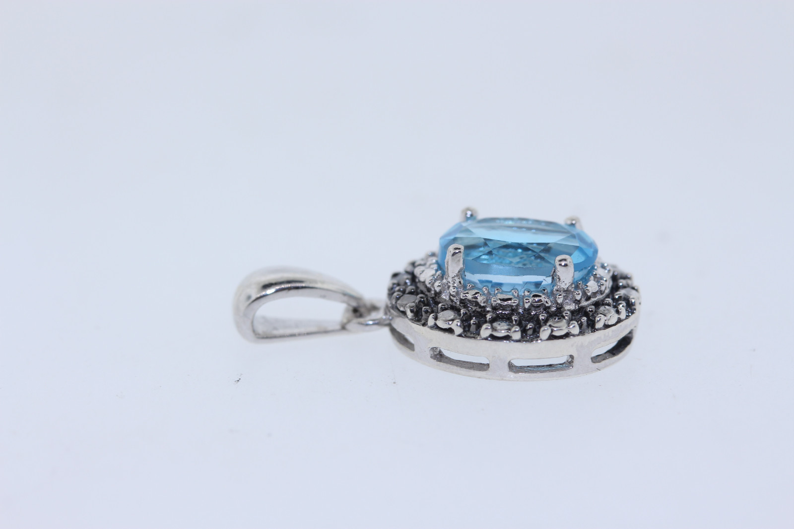 Sterling 1.25ct Oval Swiss Lab Created Blue Topaz .02ct Diamond Halo Pendant