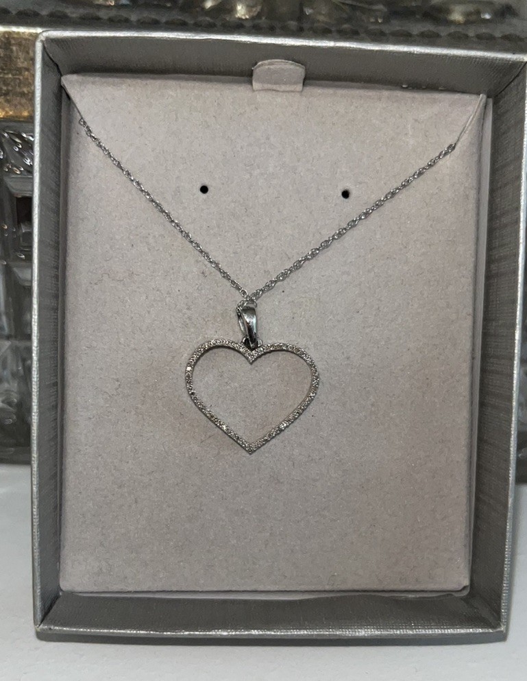 1/8 CT. T.W. Diamond Heart Outline Pendant in 10K White Gold