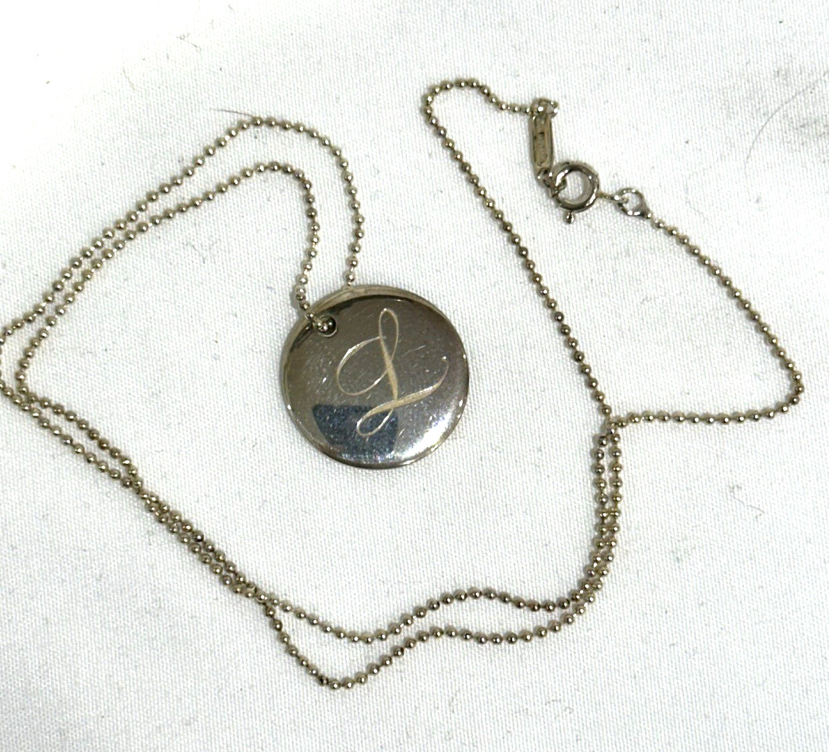 TIFFANY & CO INITIAL “L” DISC NECKLACE WITH BALL CHAIN AND POUCH