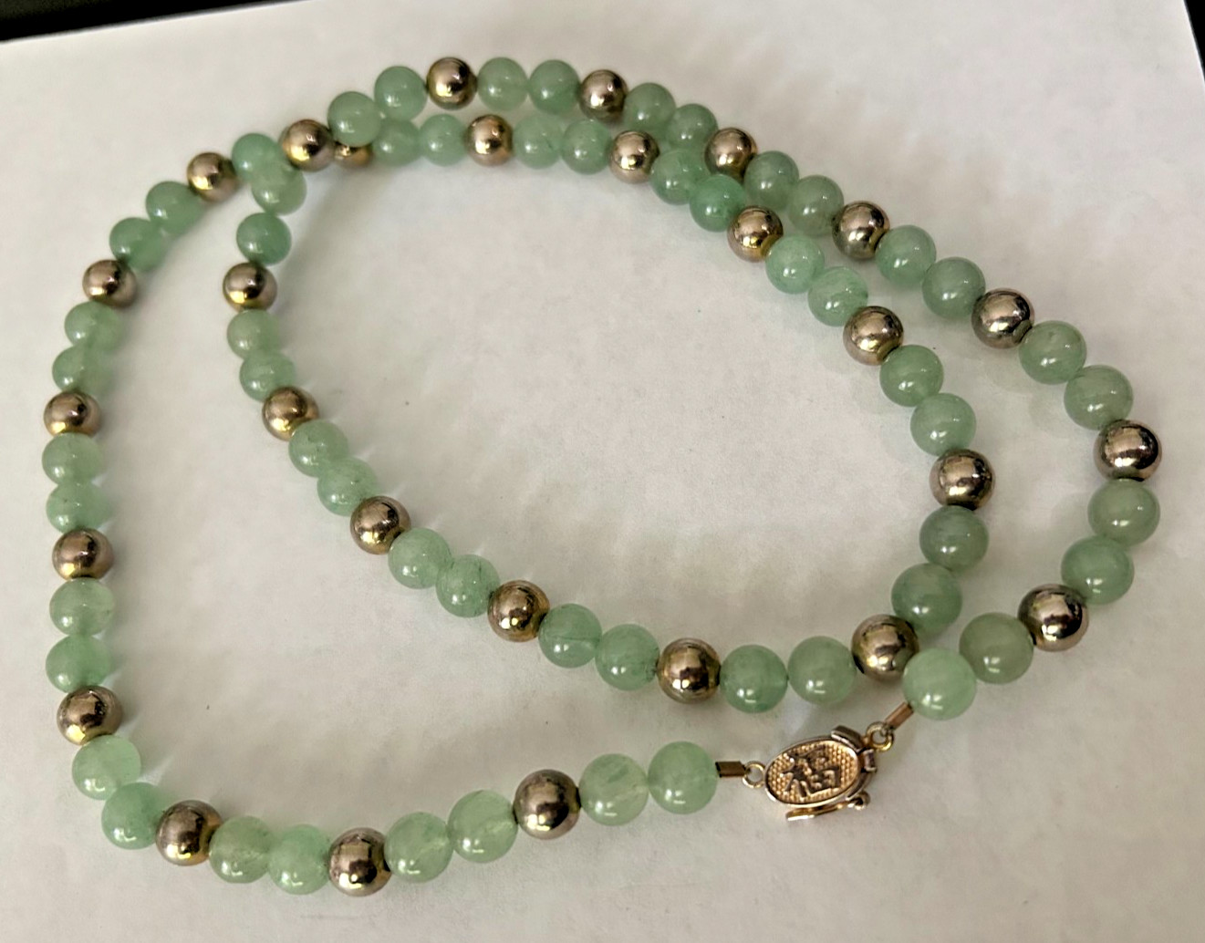 27 inch 7 MM Jade Bead Necklace with Gold Tone Spacers and Clasp