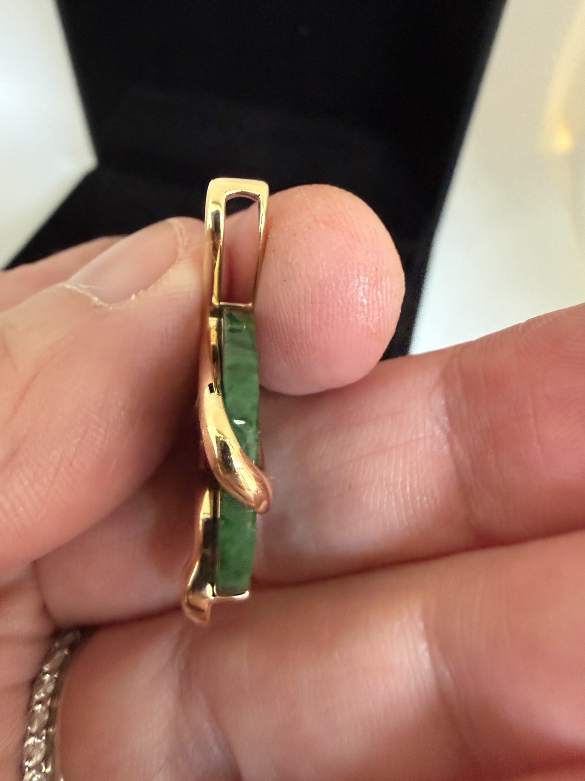 Natural Type A jadeite pendant with an 18K gold serpent wrap – from Kathy Jade