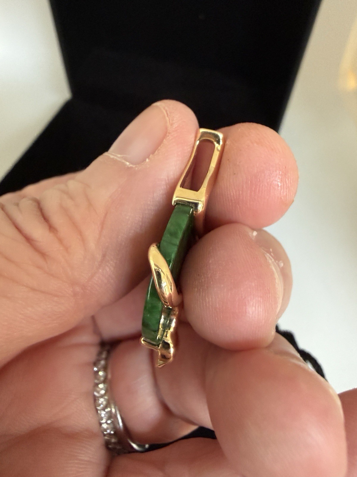 Natural Type A jadeite pendant with an 18K gold serpent wrap – from Kathy Jade