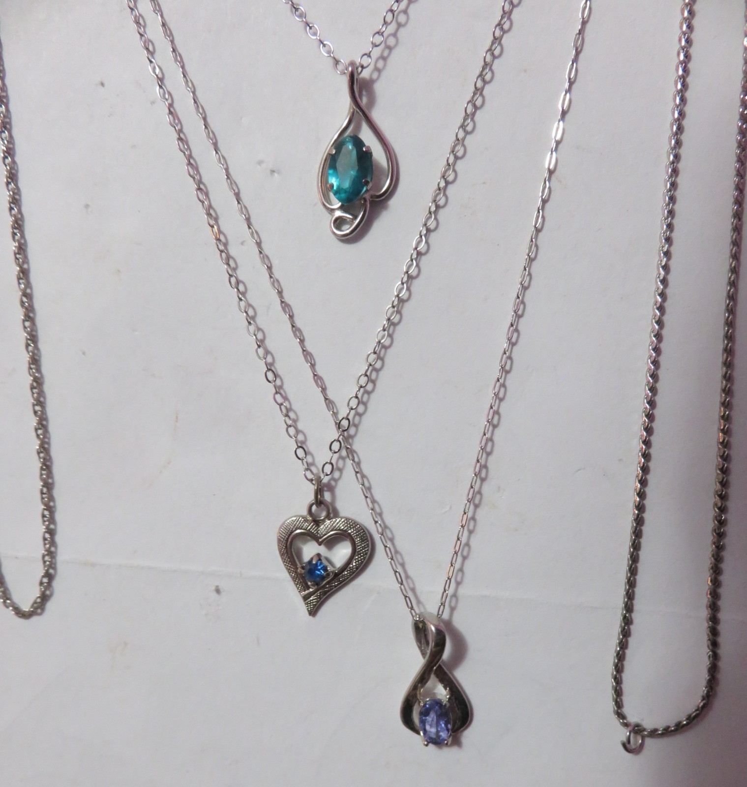 4 MARKED “STERLING” SILVER & ONE BGE CHAIN NECKLACES & 3 PENDANTS 8 GRAMS