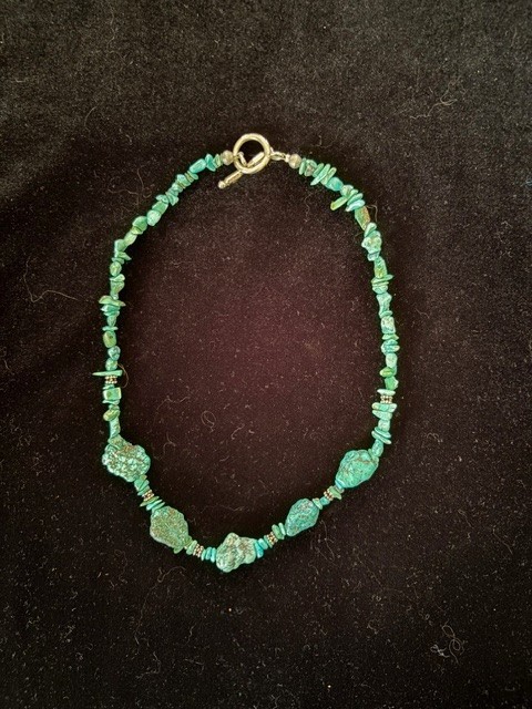 Turquoise necklace approximately 18 inches 5 larger nuggets with smaller nuggets