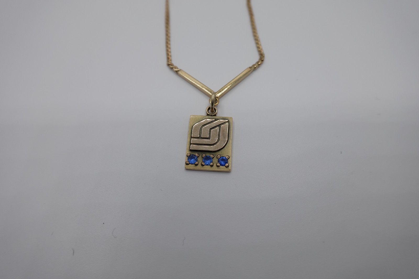 10k stamped gold pendant with unknown stones clasp on chain is stamped 1/2012