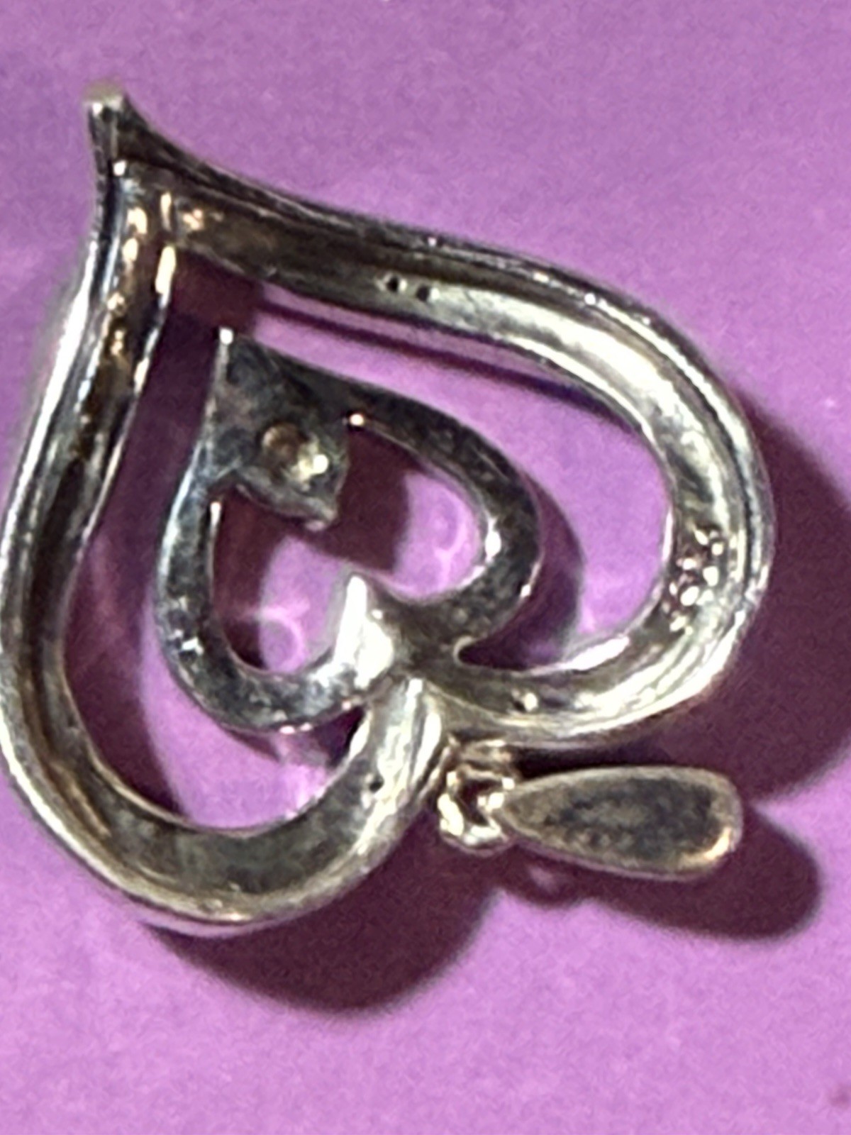 Marked 925 silver double heart pendant. 3.5 Grams Diamond Chips