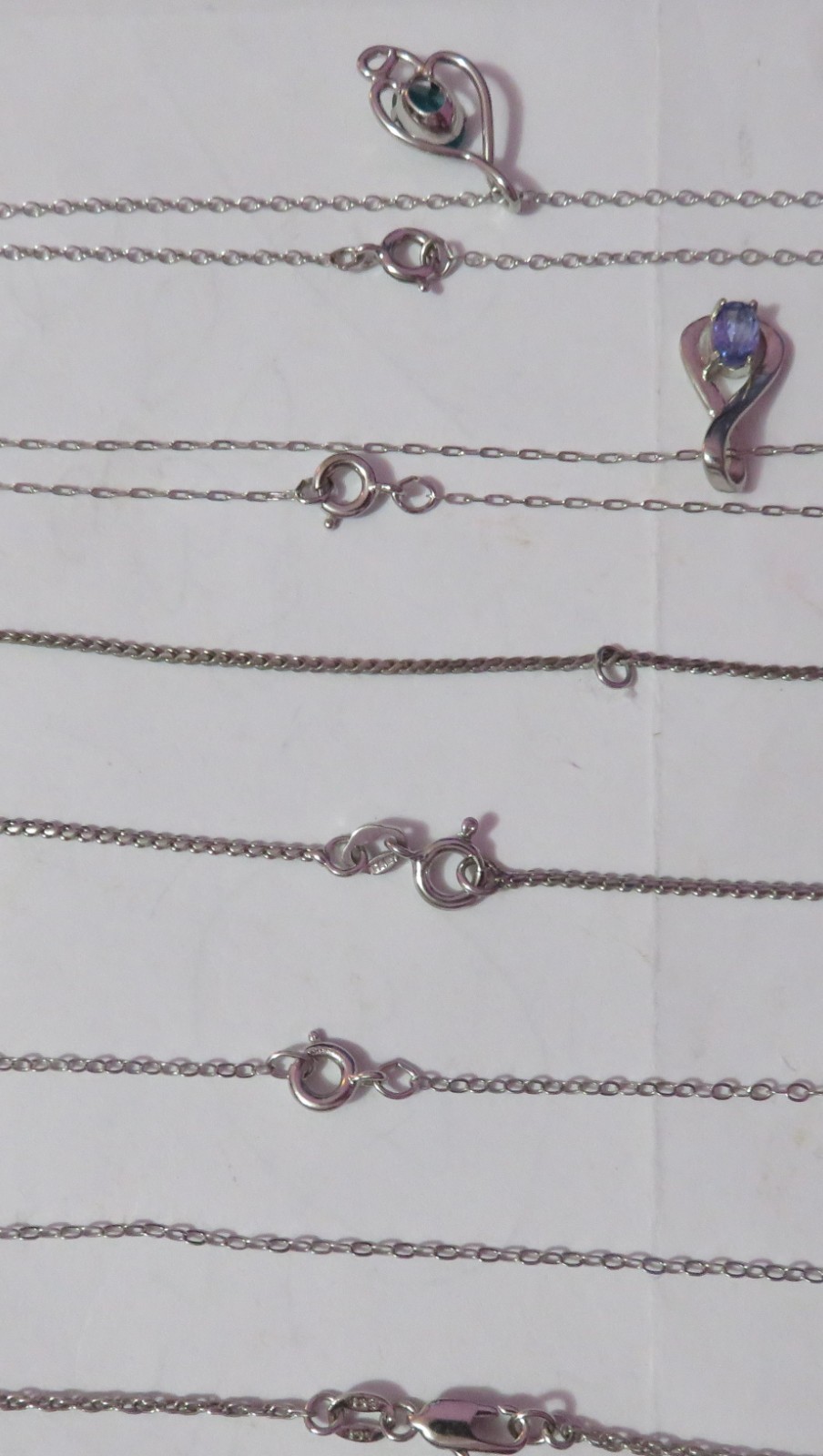 4 MARKED “STERLING” SILVER & ONE BGE CHAIN NECKLACES & 3 PENDANTS 8 GRAMS