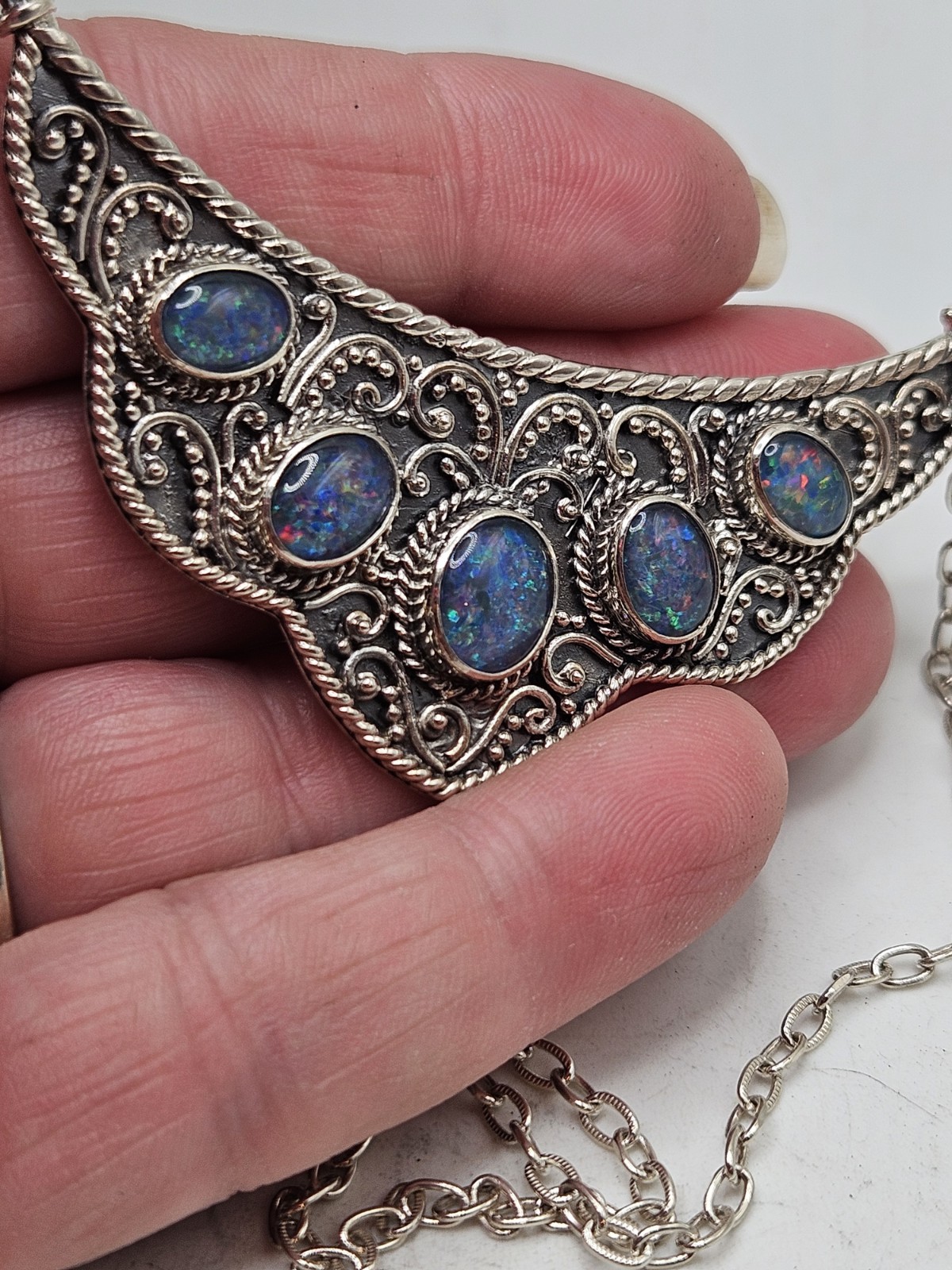Sterling Silver Bib Style Necklace With 5 Oval Bezel Set Opals. 20″ Marked. 925.