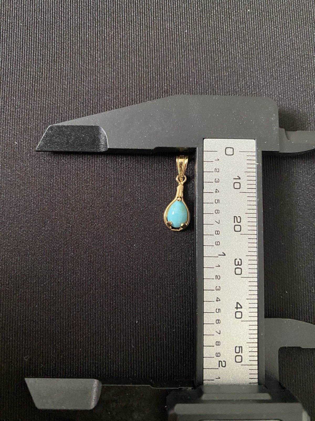 Beautiful Turquoise Pendant Set In 14K Yellow Gold On A Blue Cord