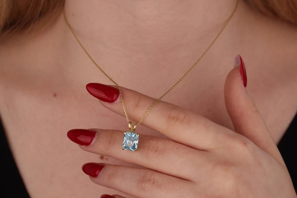 2 Ct Emerald Cut Lab Created Blue Topaz Women’s Pendant 14K Yellow Gold Plated