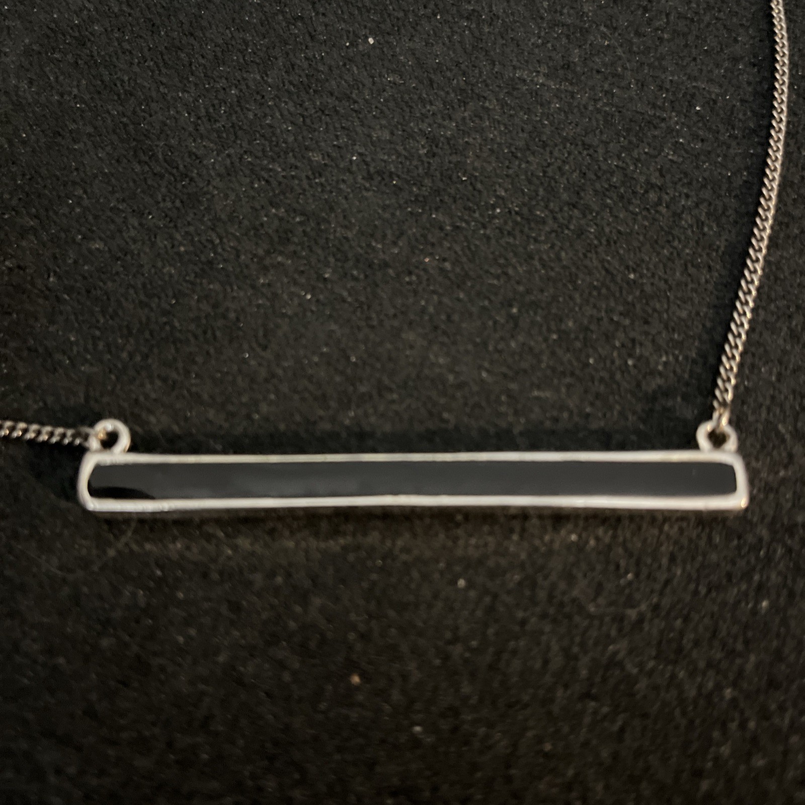 Reversible Jade/Onyx Pendant Bar. Pendant encased in silver. Chain is not silver