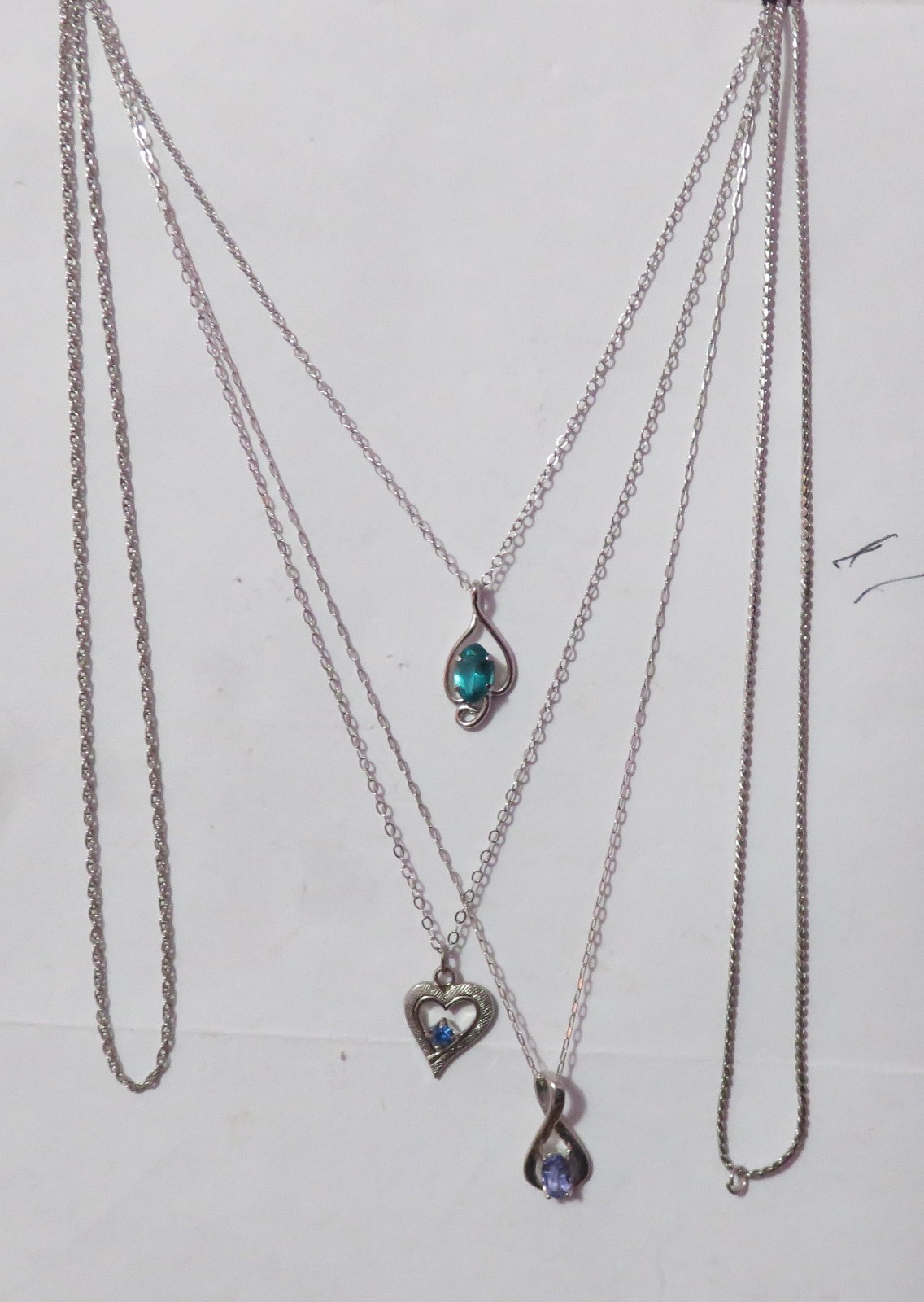 4 MARKED “STERLING” SILVER & ONE BGE CHAIN NECKLACES & 3 PENDANTS 8 GRAMS