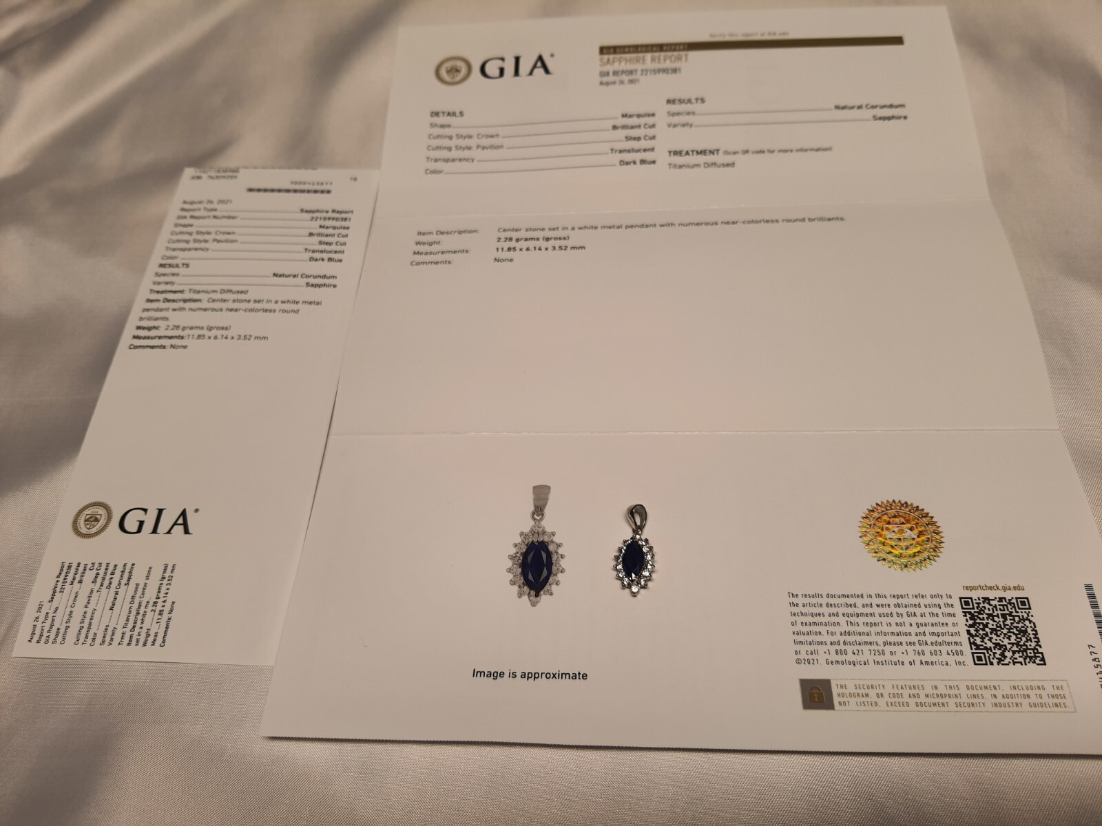 GIA Certified Natural Blue Sapphire heated with near colorless brilliants