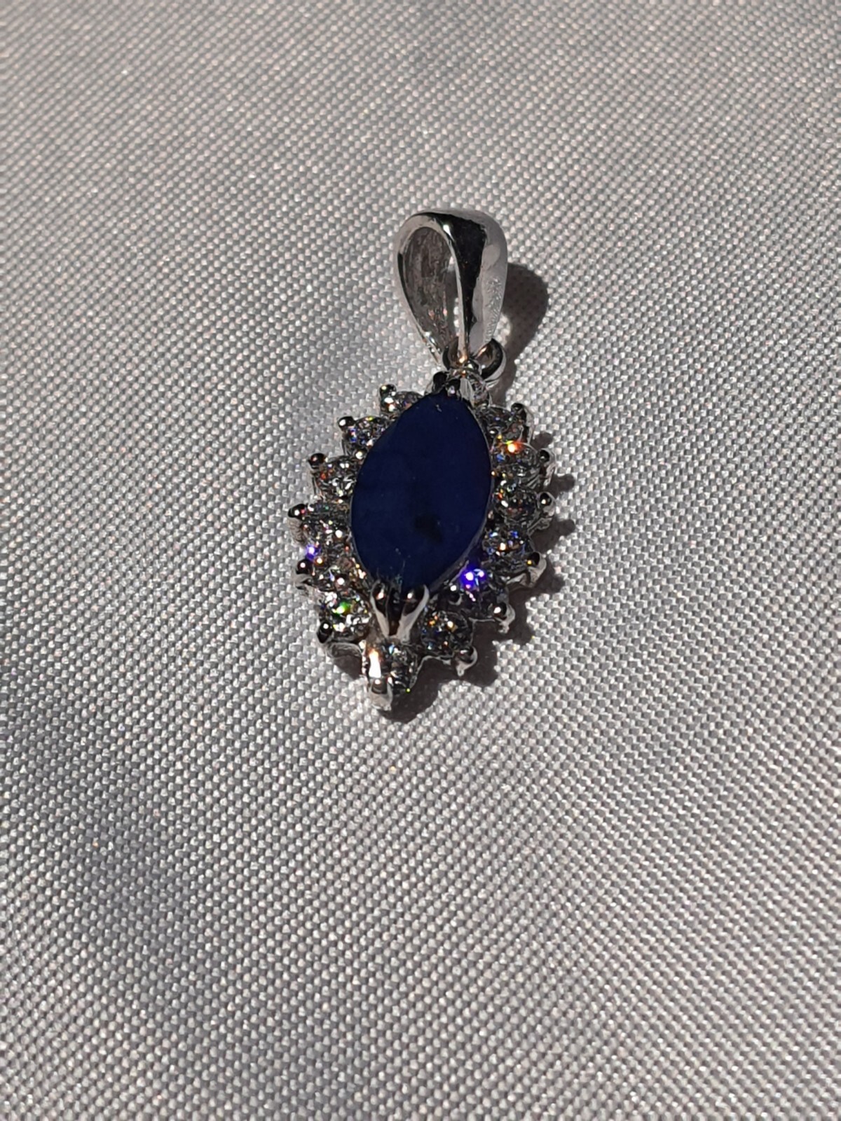 GIA Certified Natural Blue Sapphire heated with near colorless brilliants