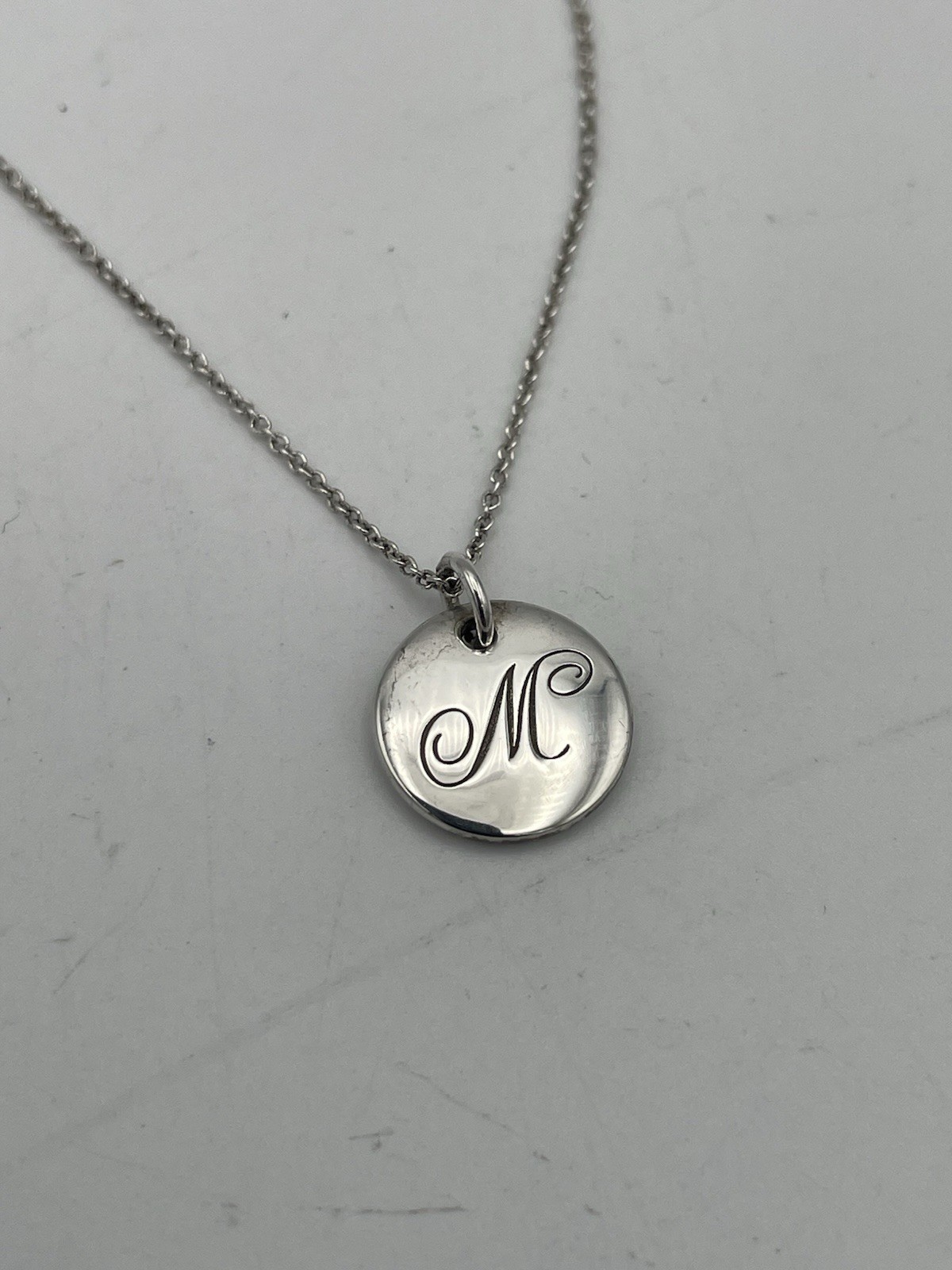Tiffany & Co. Notes Initial Letter M Disc Pendant Necklace Sterling Silver 16″