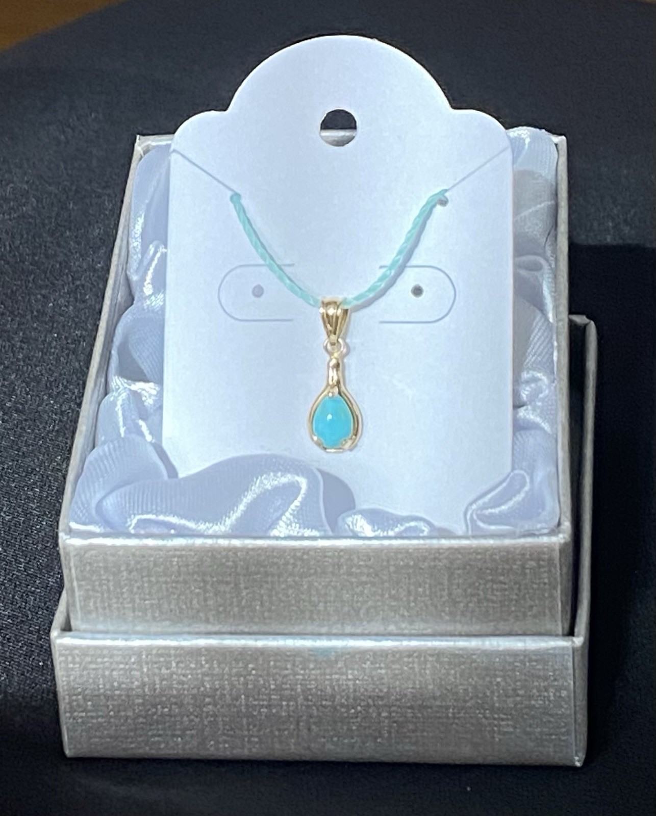 Beautiful Turquoise Pendant Set In 14K Yellow Gold On A Blue Cord