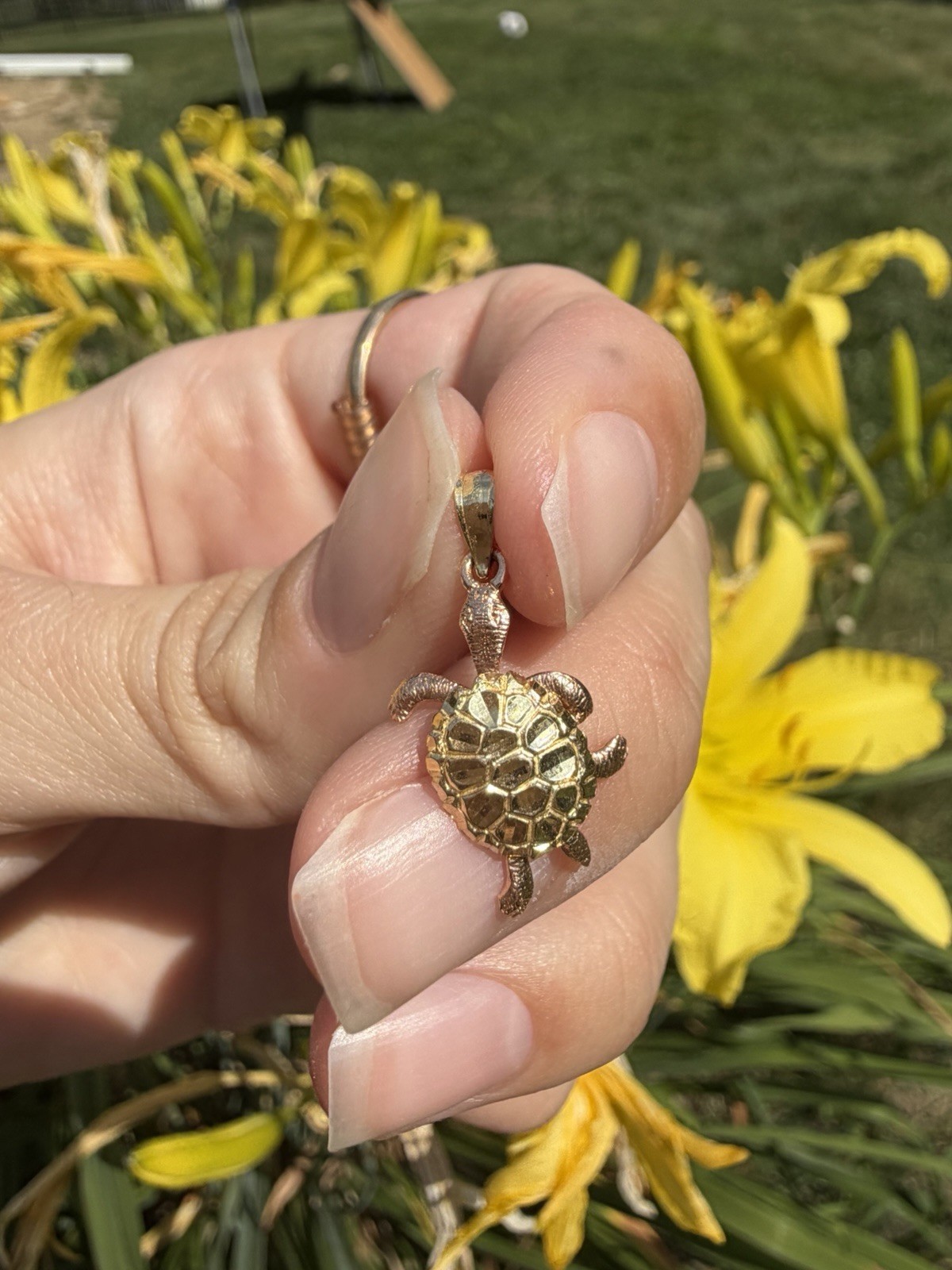 The most adorable 14k gold turtle pendant! The legs move- really a unique piece