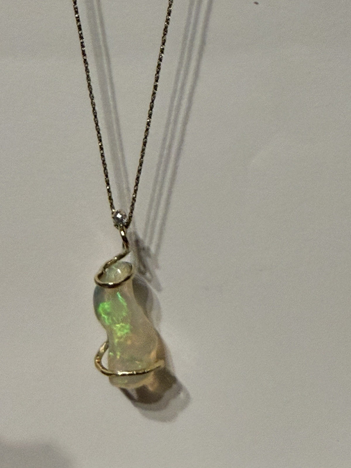 14k Solid Gold 4.90 carats opal and diamond pendant .
