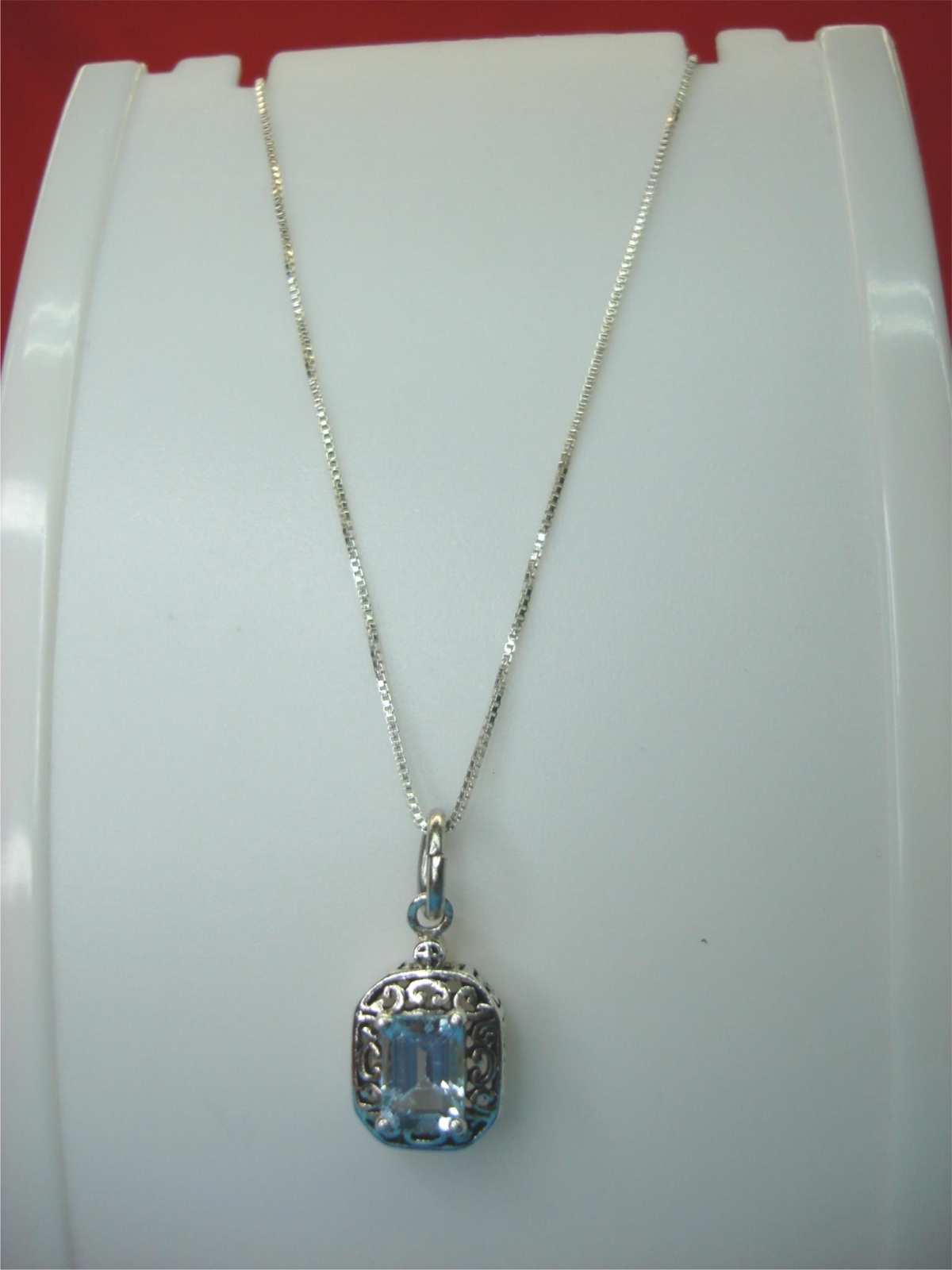 STERLING SILVER FANCY PENDANT WITH LIGHT BLUE STONE & 18″ STER. BOX LINK CHAIN