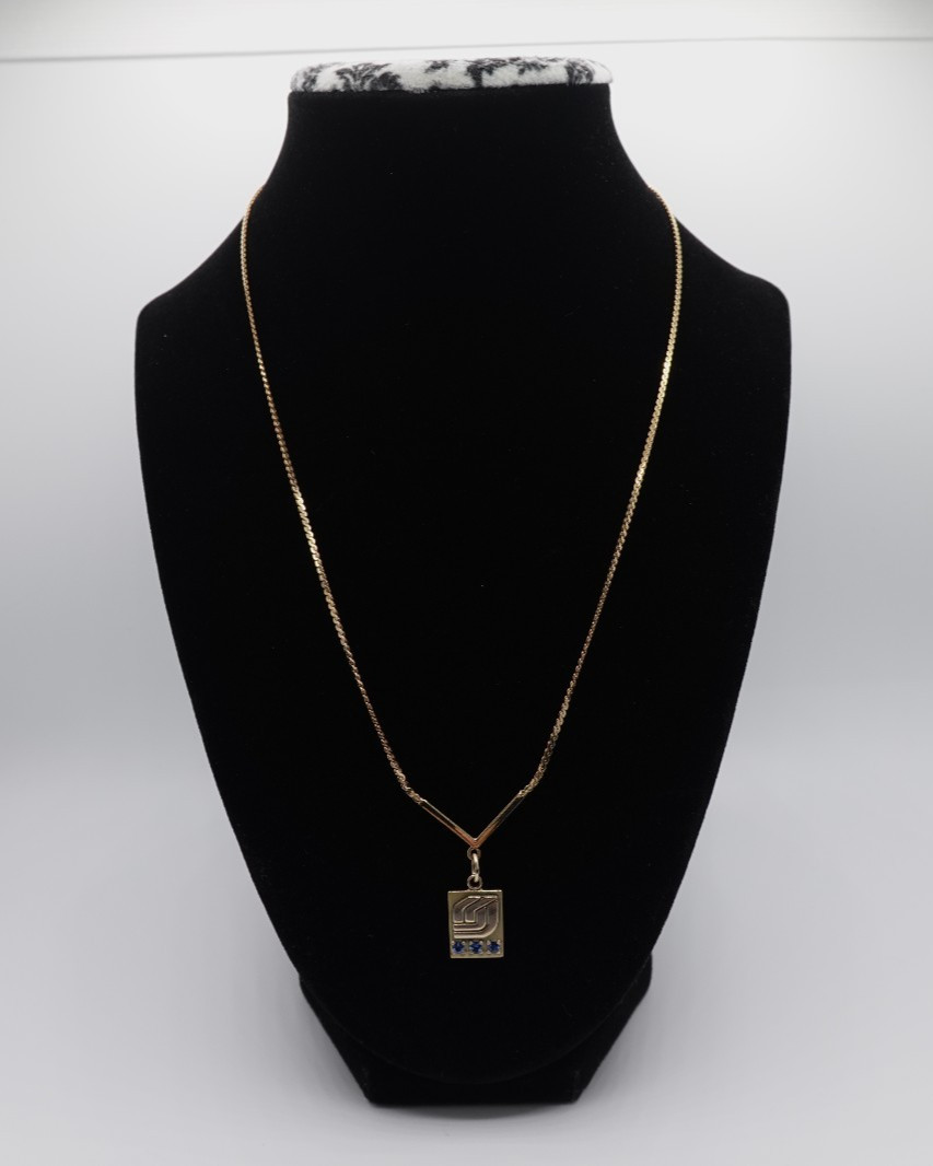 10k stamped gold pendant with unknown stones clasp on chain is stamped 1/2012
