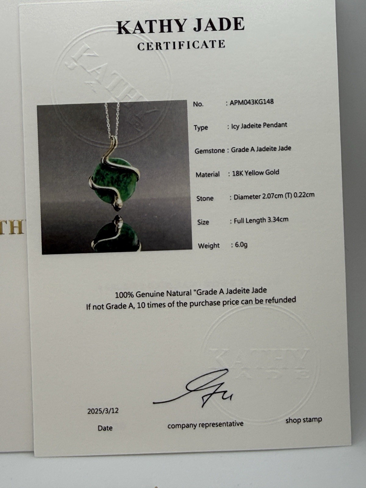Natural Type A jadeite pendant with an 18K gold serpent wrap – from Kathy Jade