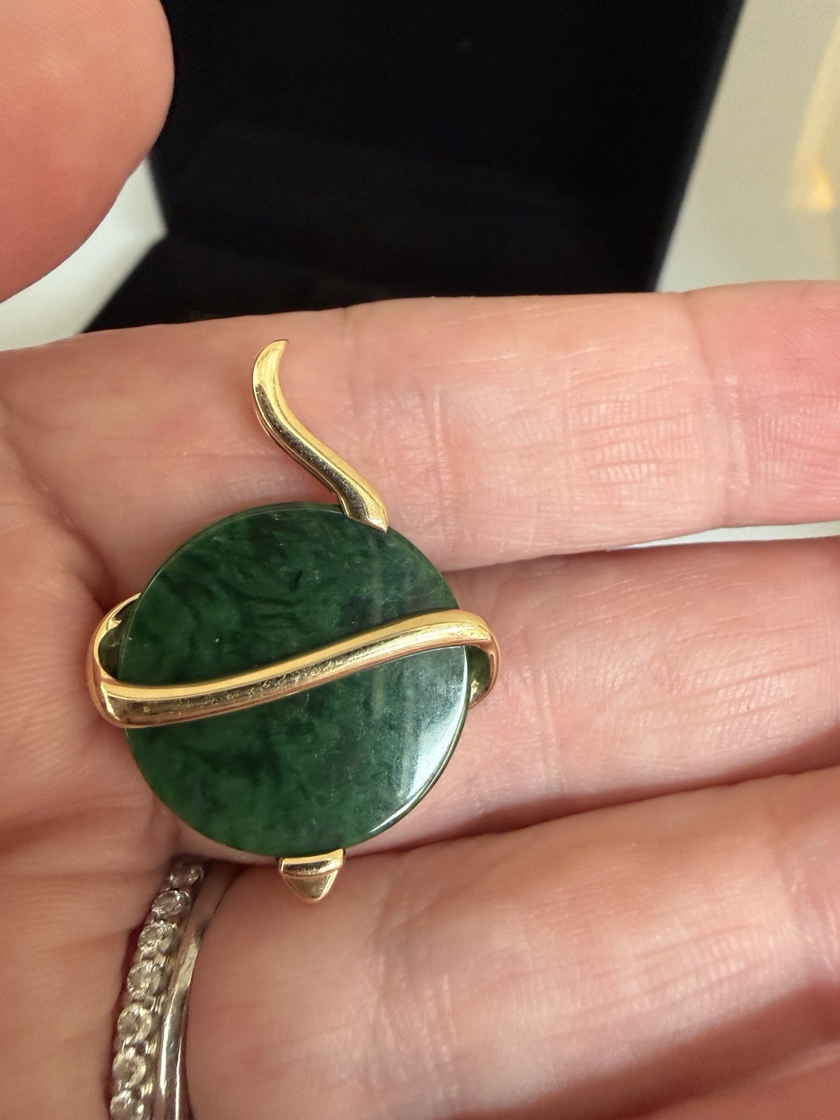 Natural Type A jadeite pendant with an 18K gold serpent wrap – from Kathy Jade