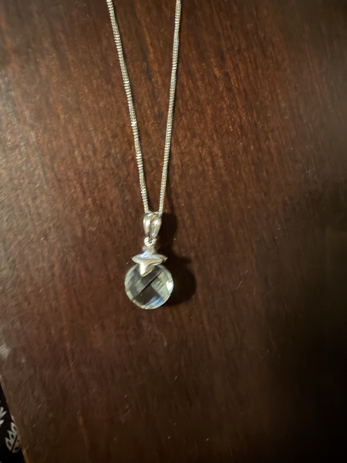 Sterling Silver and Green Amethyst pendant on a chain.