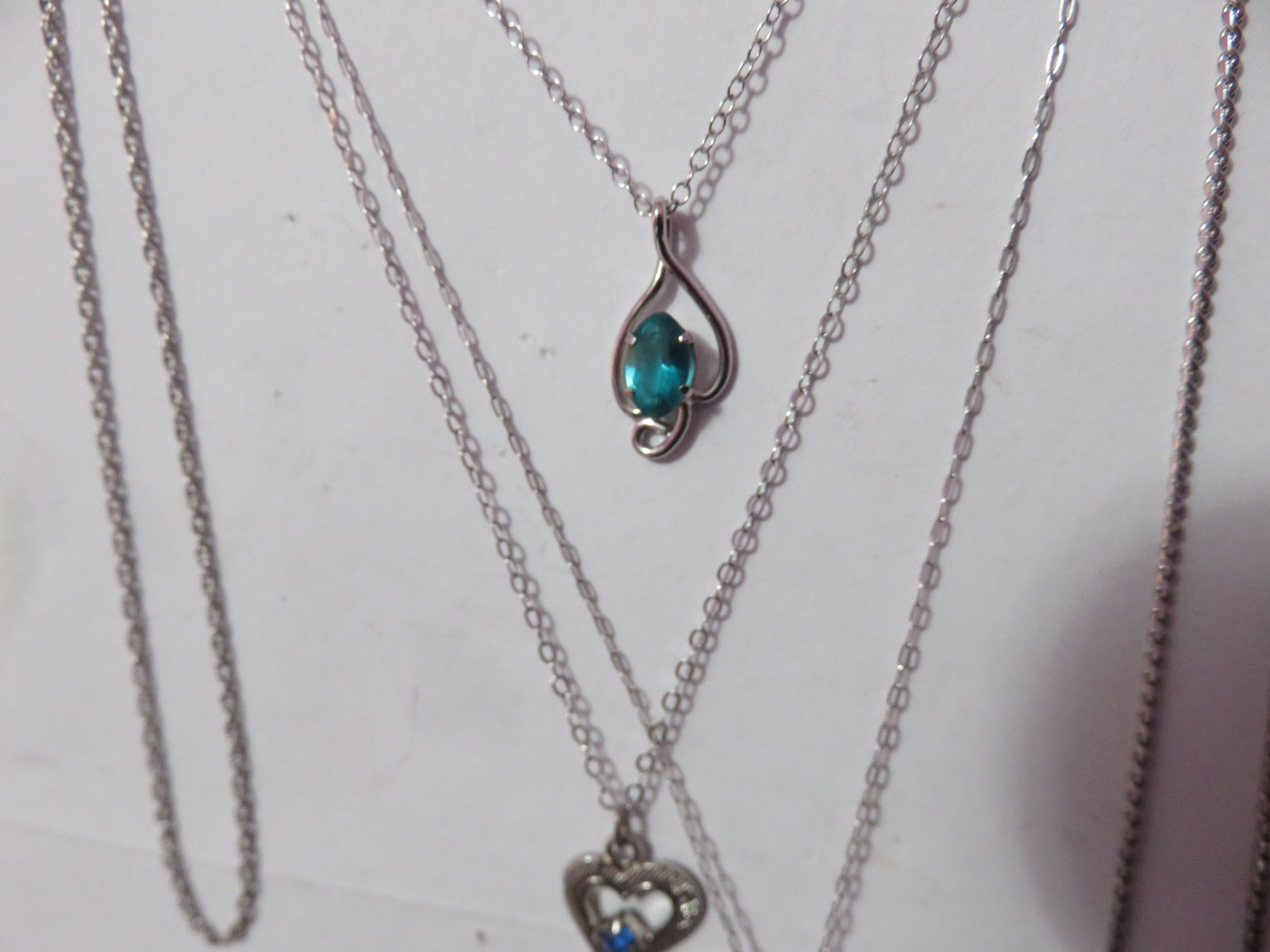 4 MARKED “STERLING” SILVER & ONE BGE CHAIN NECKLACES & 3 PENDANTS 8 GRAMS