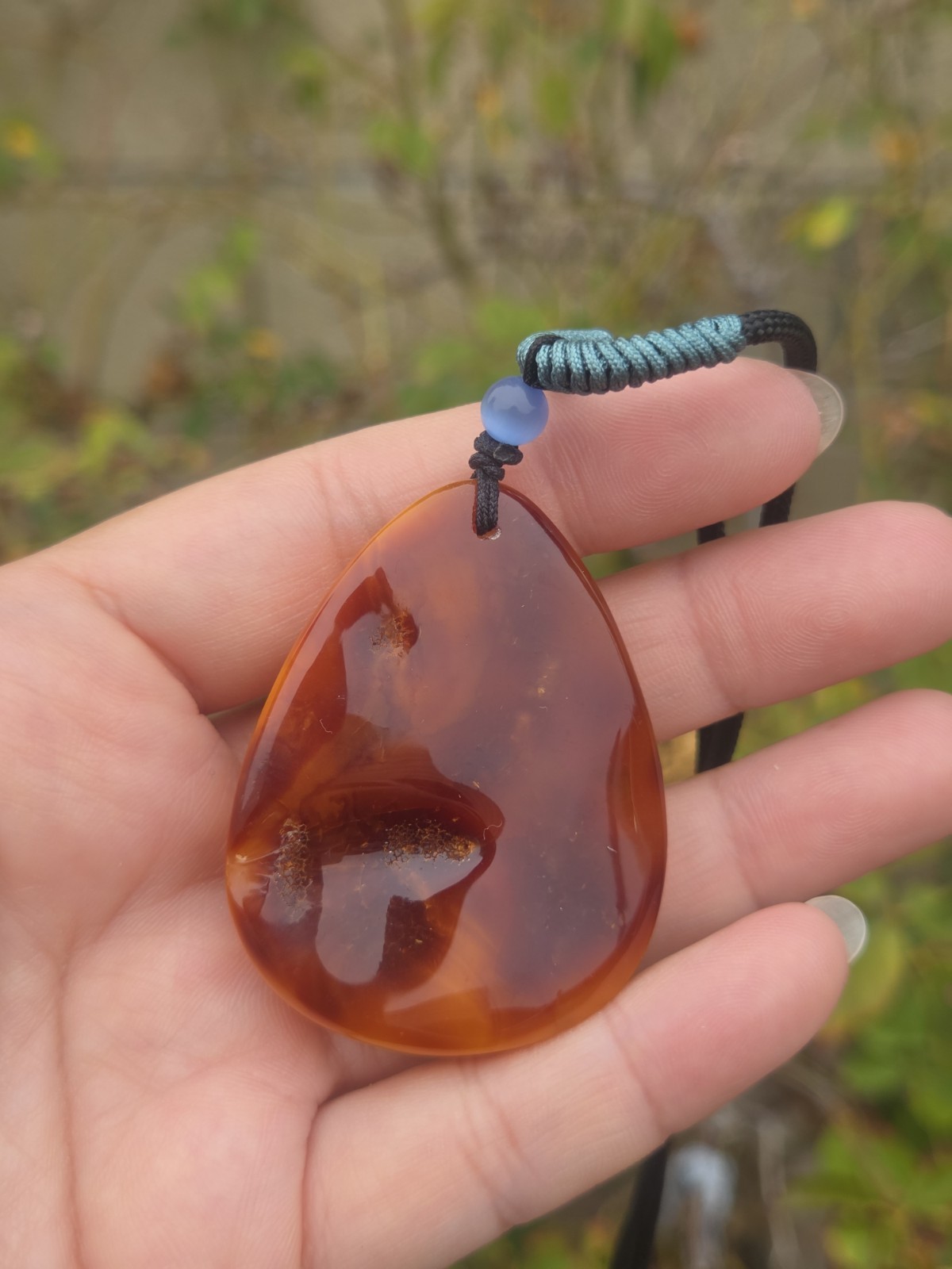 Rich Egg Yolk Amber Teardrop Pendant with Natural Red Skin