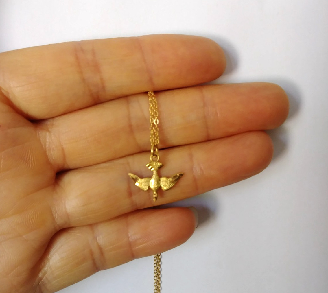 10k yellow gold with yellow gold bird pendent 16″ 1.4g 1mm necklace