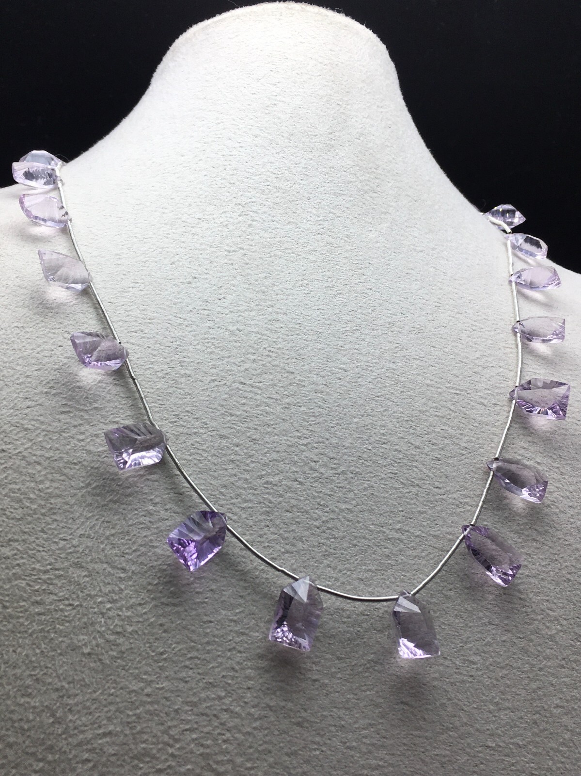 Natural LIGHT AMETHYST/Fancy/Concave/7x11M till 8x14MM/105.60 Cts/19″/$ 301.00
