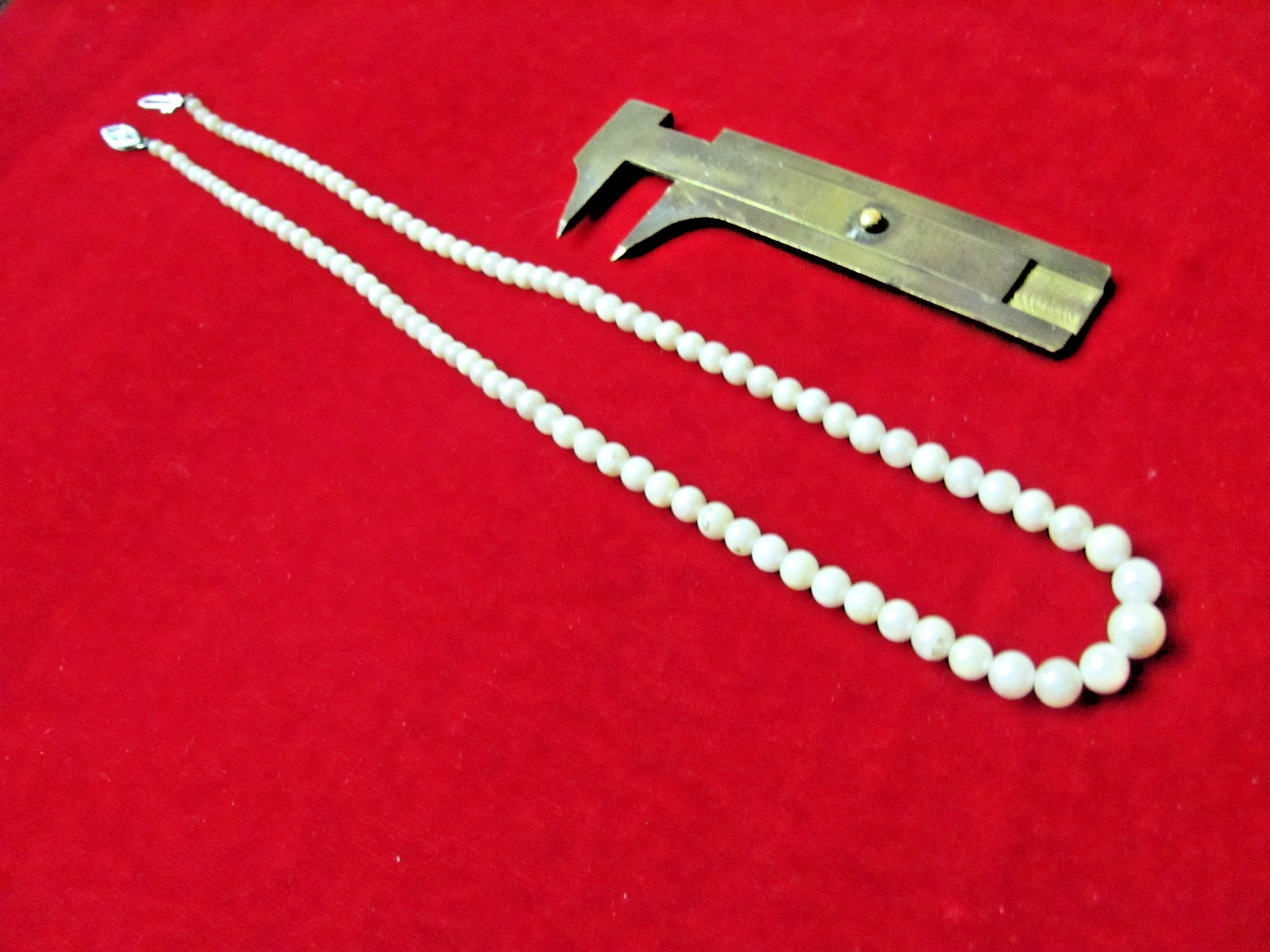 PEARLS, GRADUATED 17in STRAND, 10k WHITE GOLD SLIDE CATCH, 3mm – 7mm PEARLS, 8gr