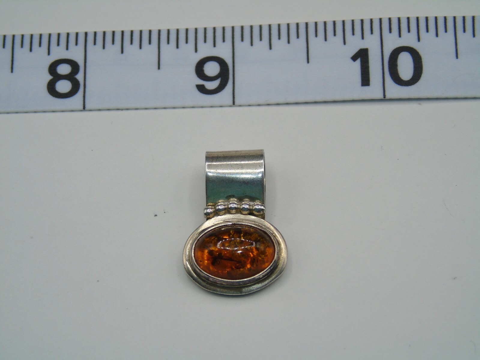 R. WILSON STERLING SILVER AND OPAL PENDANT IN PRE-OWNED VERY GOOD CONDITION