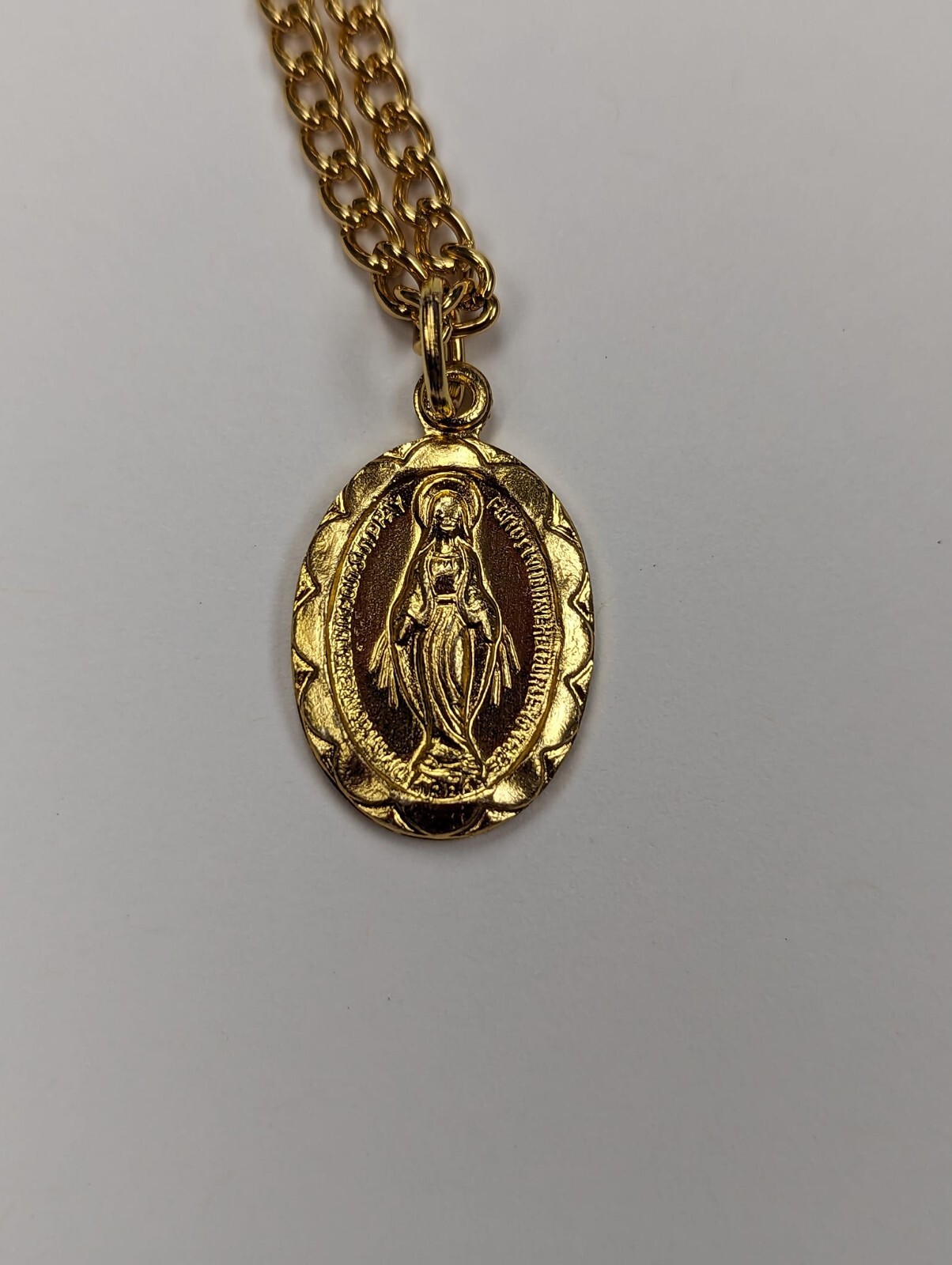 MIRACULOUS Medal Pendant, Oval 3/4″ x 1/2″ Gold Tone Aluminium on 20 inch chain