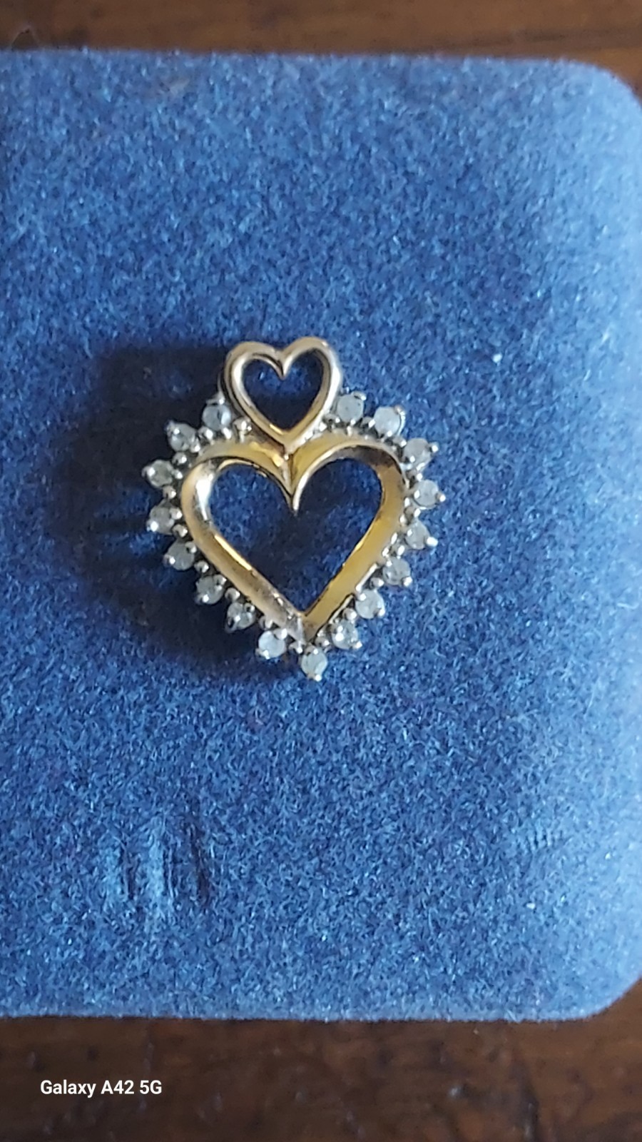 10 Karat Gold Heart Surrounded With Gem Stones and a Smaller Heart Just Above…