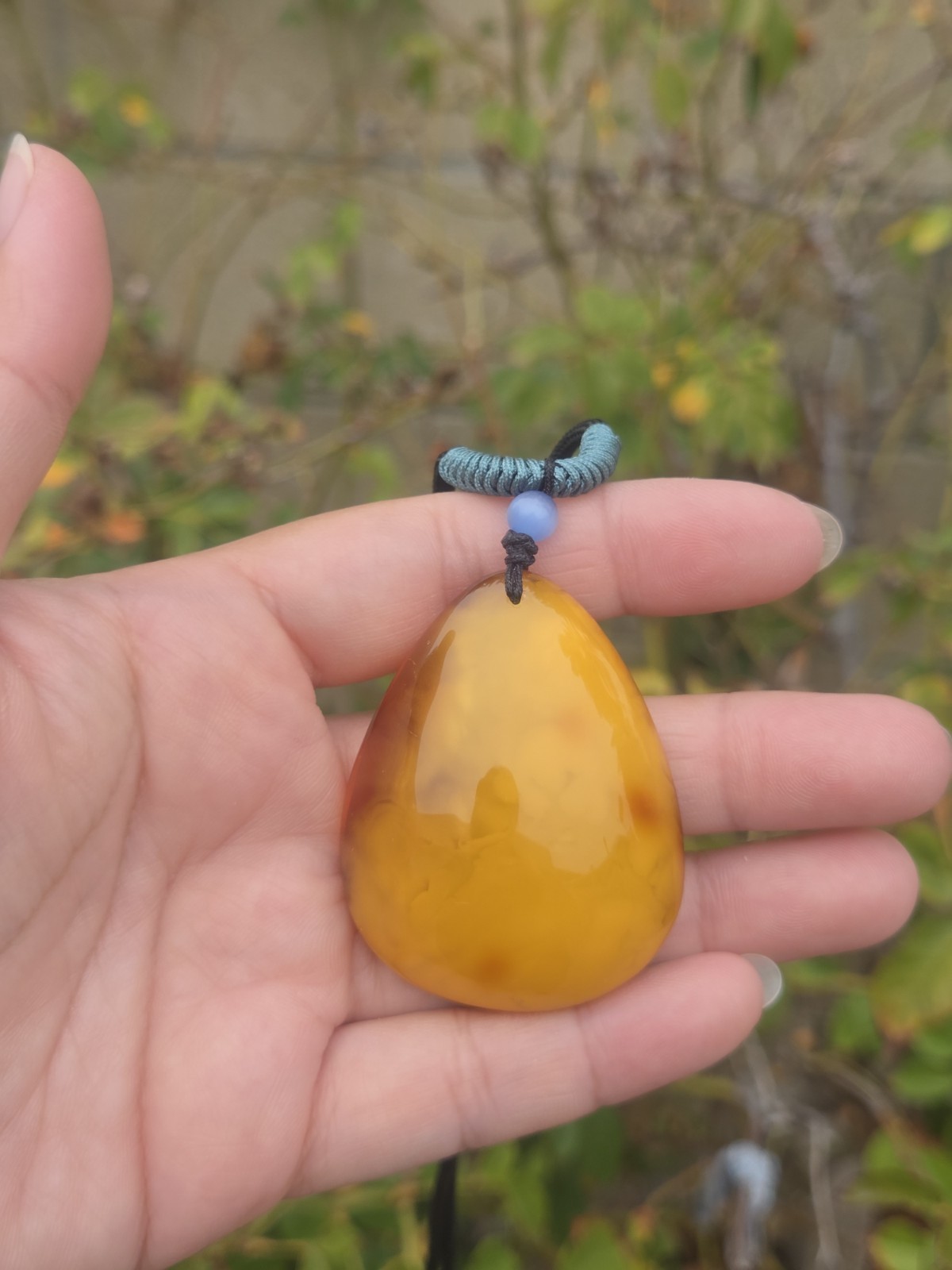 Rich Egg Yolk Amber Teardrop Pendant with Natural Red Skin