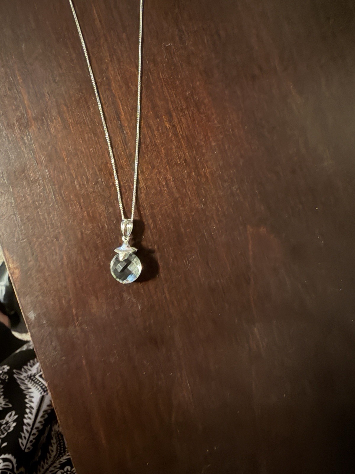 Sterling Silver and Green Amethyst pendant on a chain.