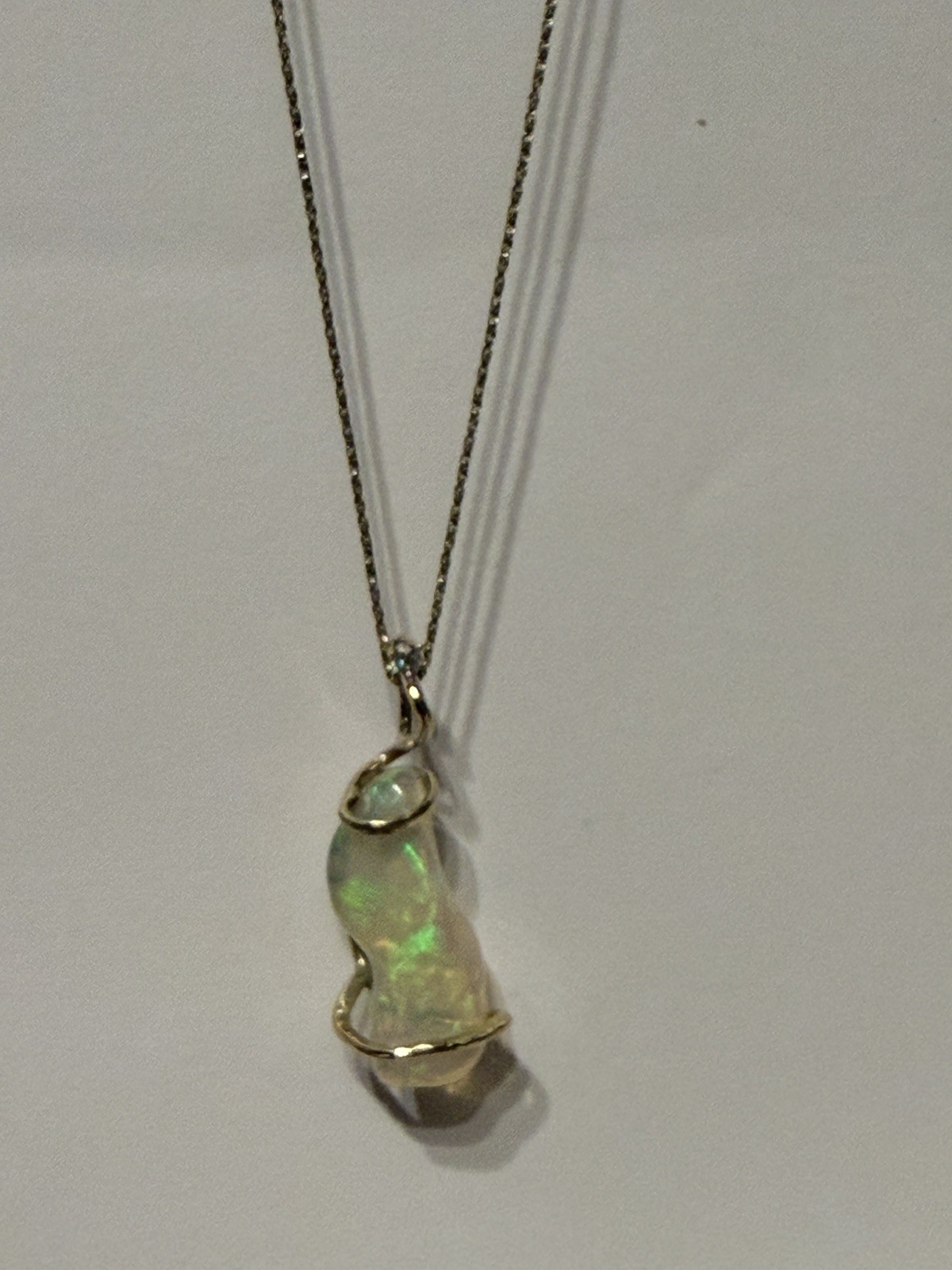 14k Solid Gold 4.90 carats opal and diamond pendant .