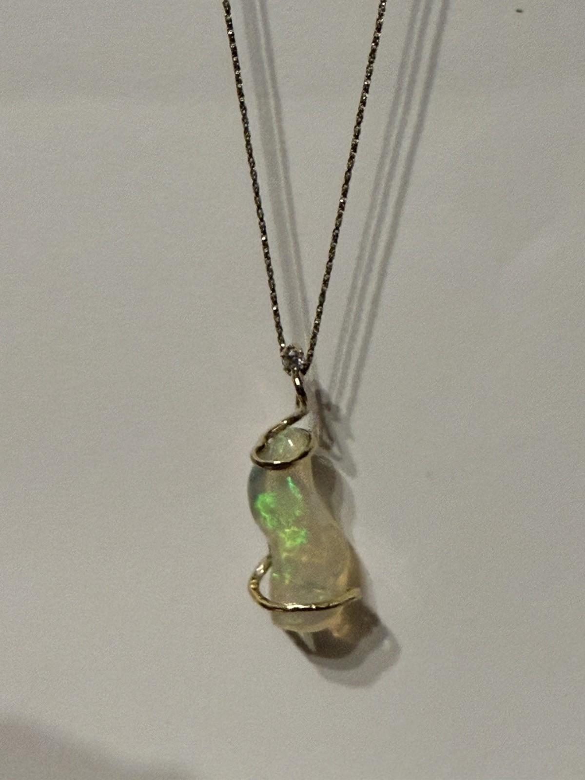 14k Solid Gold 4.90 carats opal and diamond pendant .
