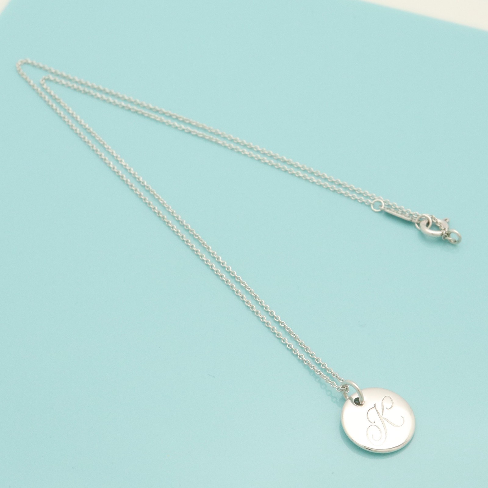 Tiffany & Co. Letter K Notes Alphabet Initial Disc Necklace 16.2″ Silver 925