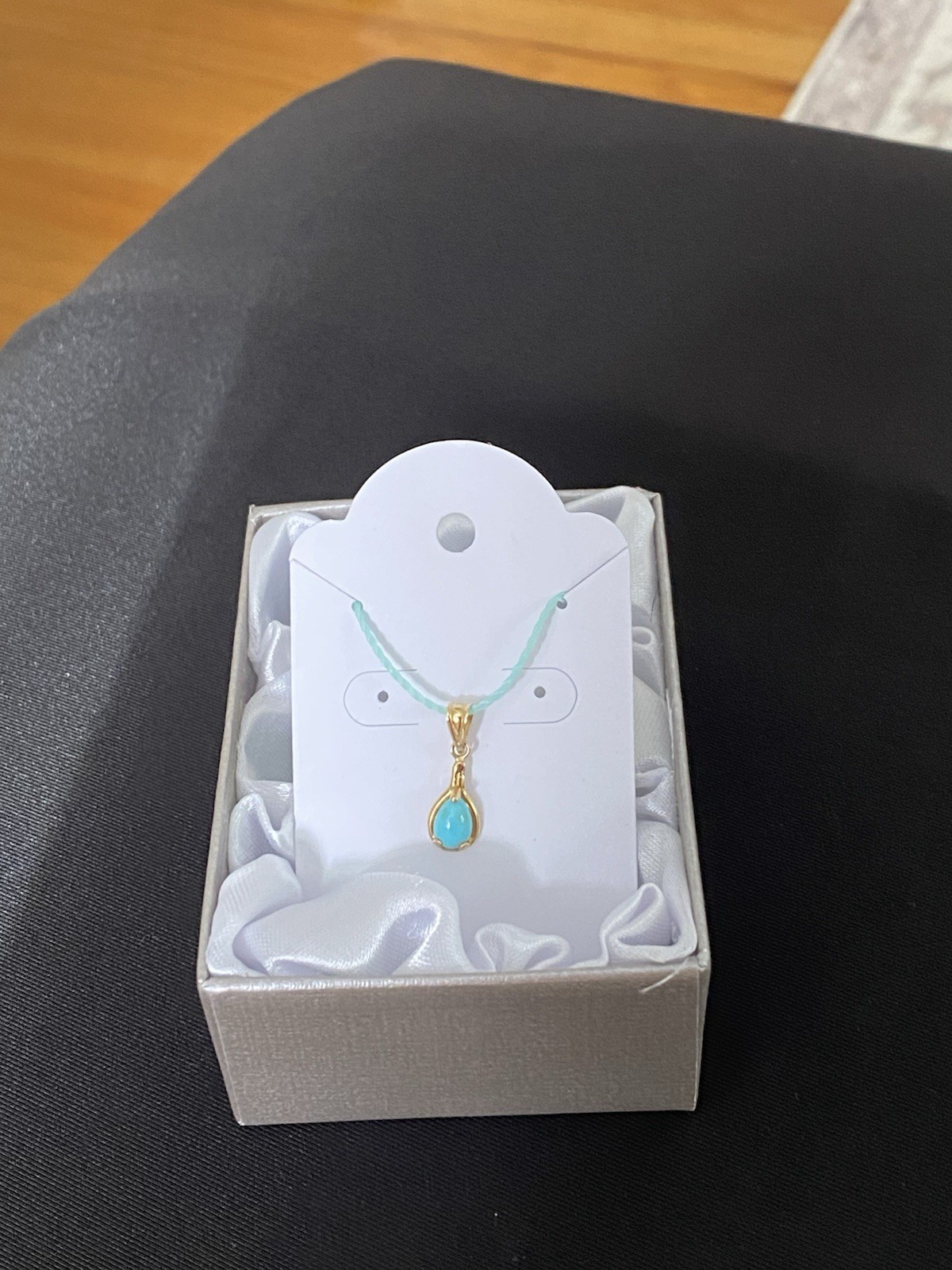 Beautiful Turquoise Pendant Set In 14K Yellow Gold On A Blue Cord