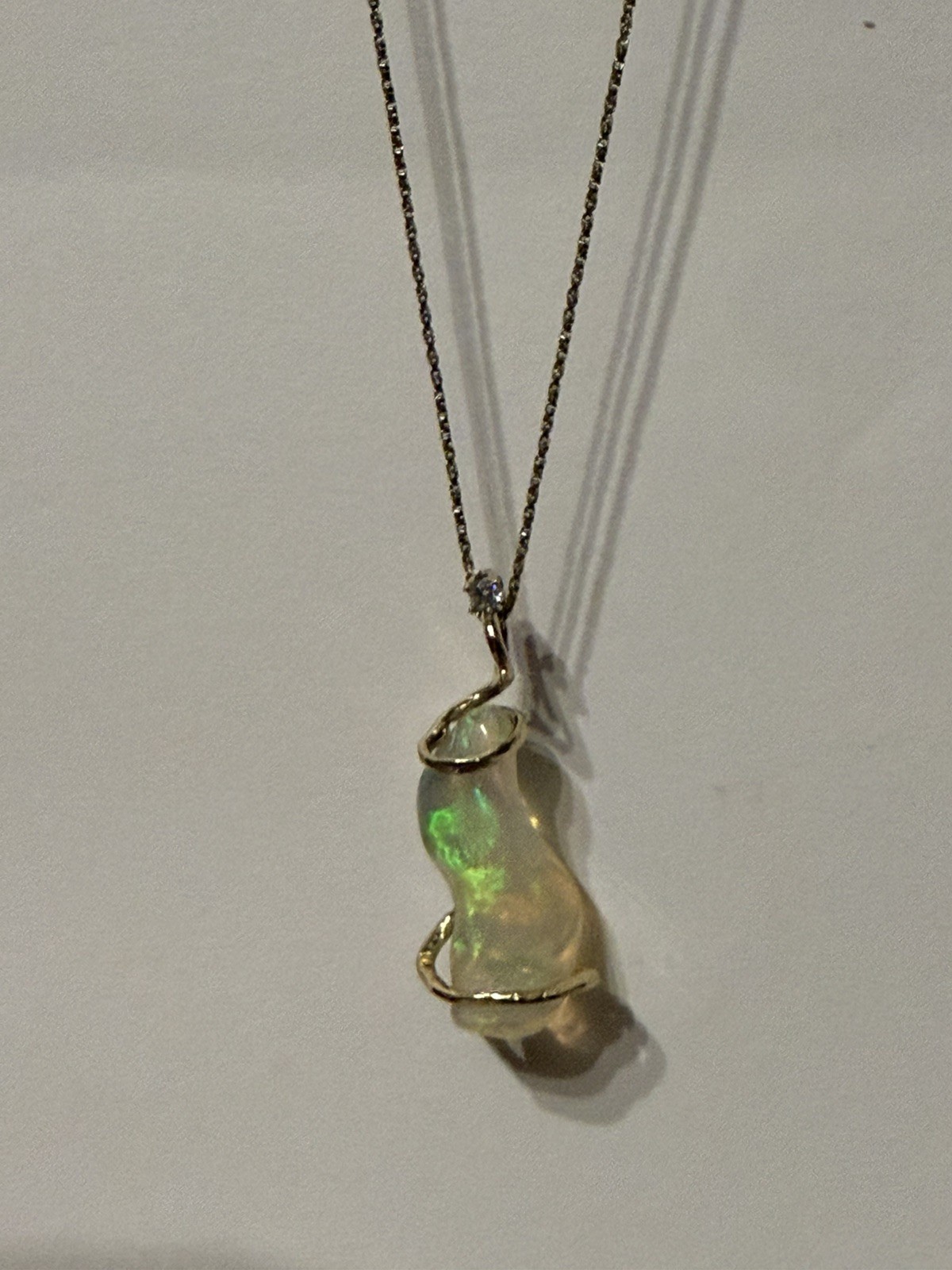 14k Solid Gold 4.90 carats opal and diamond pendant .