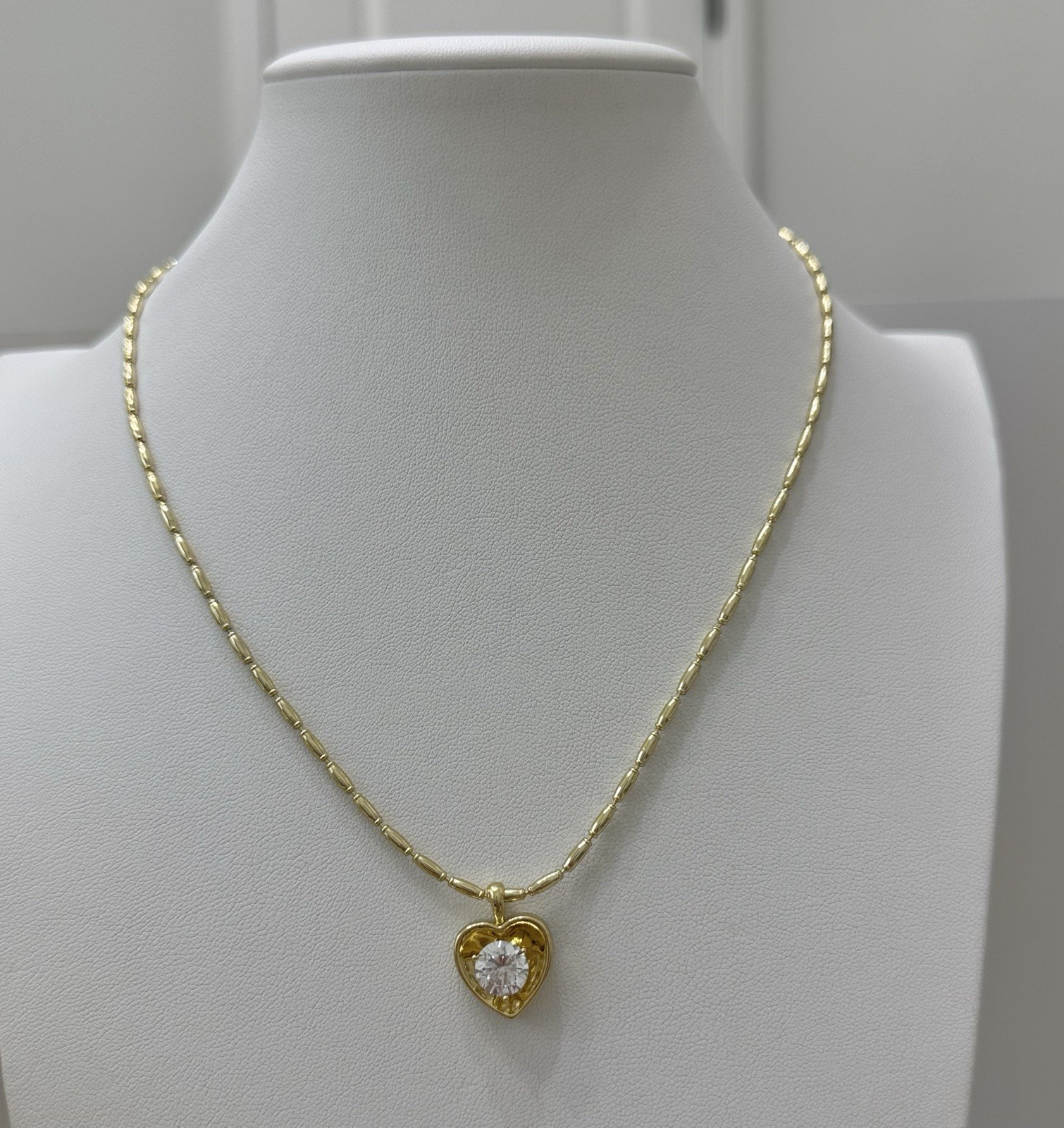 Chain with heart charm bezel set round clear stone laminated in 14k high quality