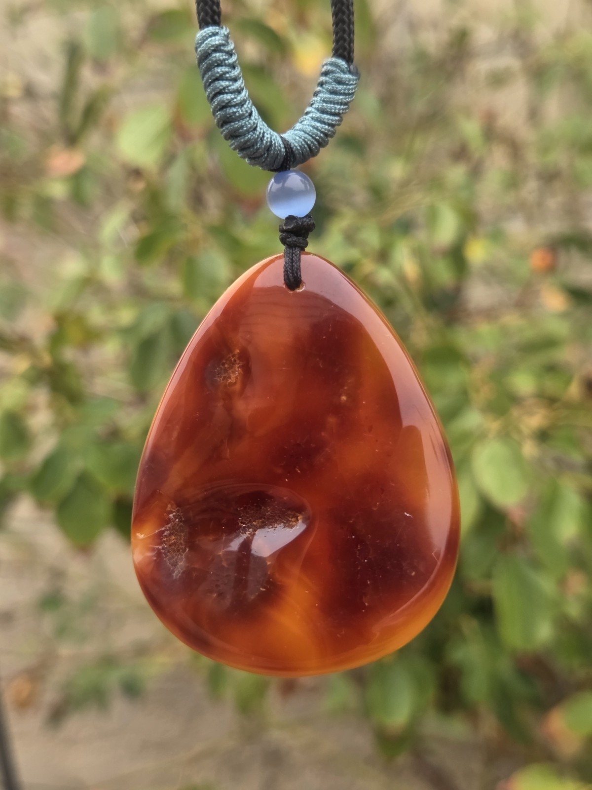 Rich Egg Yolk Amber Teardrop Pendant with Natural Red Skin