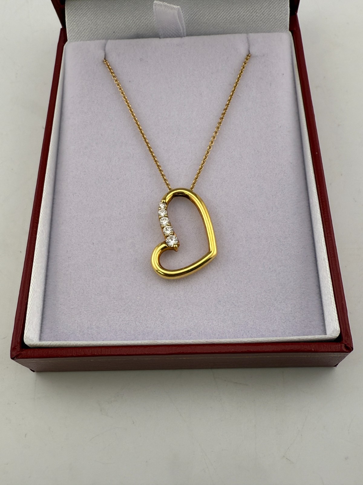 Movado 18k Yellow Gold Diamond Asymmetrical Graduated Heart Necklace 0.30ctw 16″