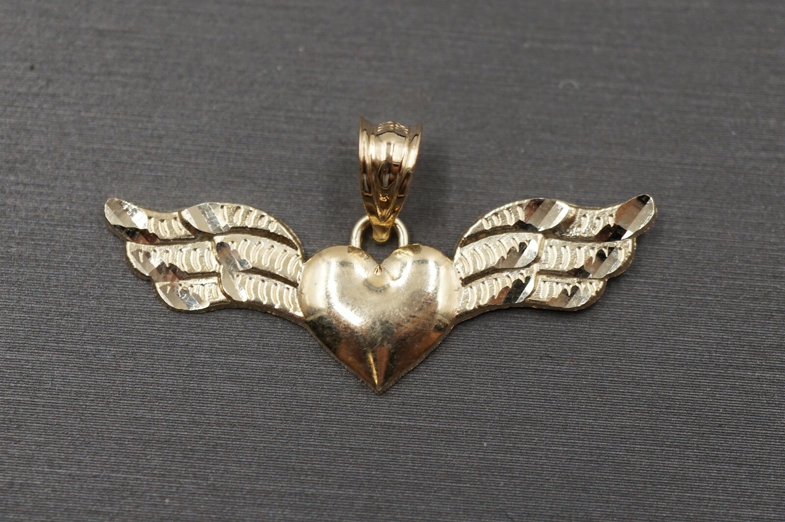 10K Solid Yellow Gold 0.65″ x 1.3″ Diamond Cut Heart With Wing Charm Pendant.