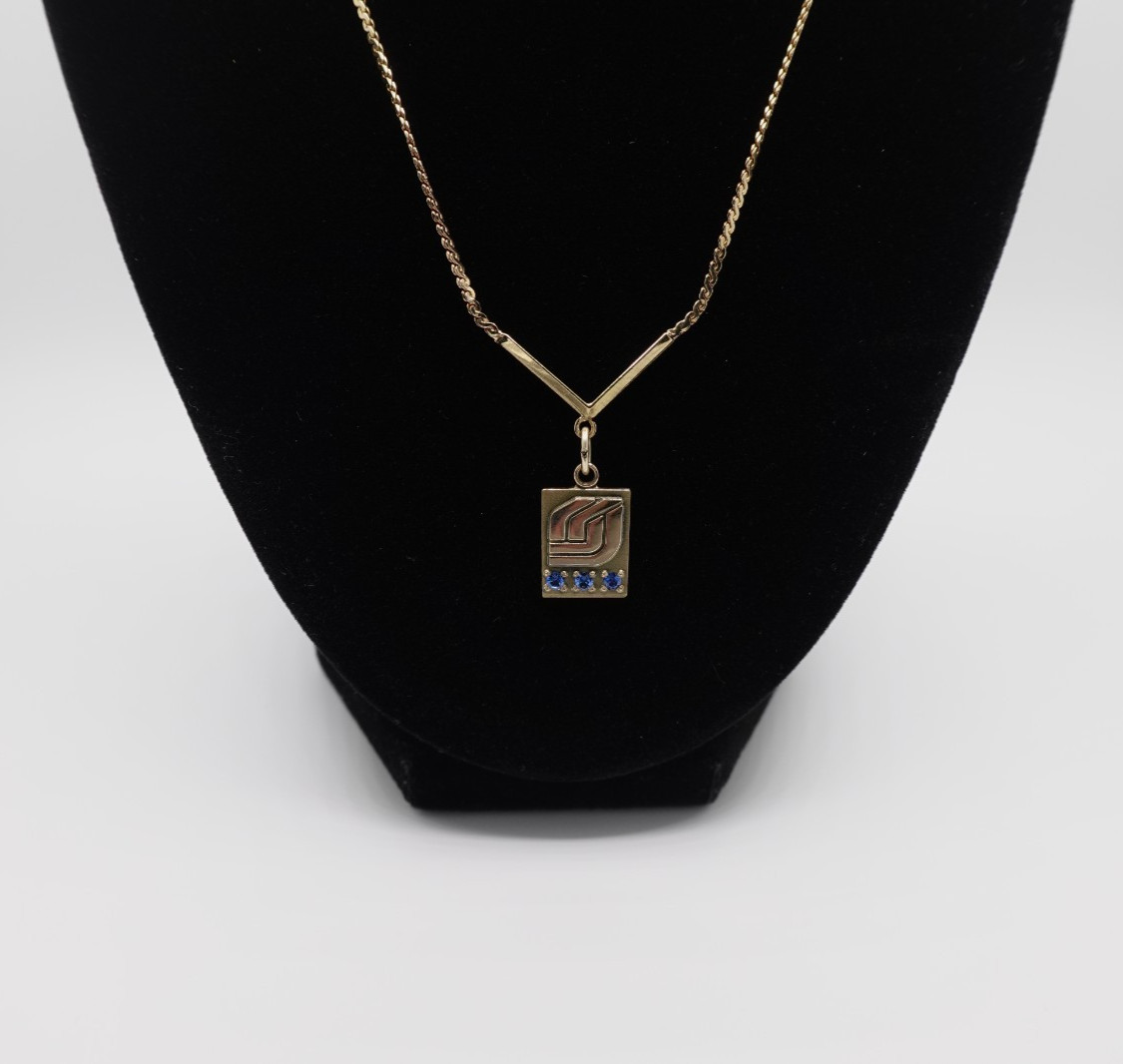 10k stamped gold pendant with unknown stones clasp on chain is stamped 1/2012