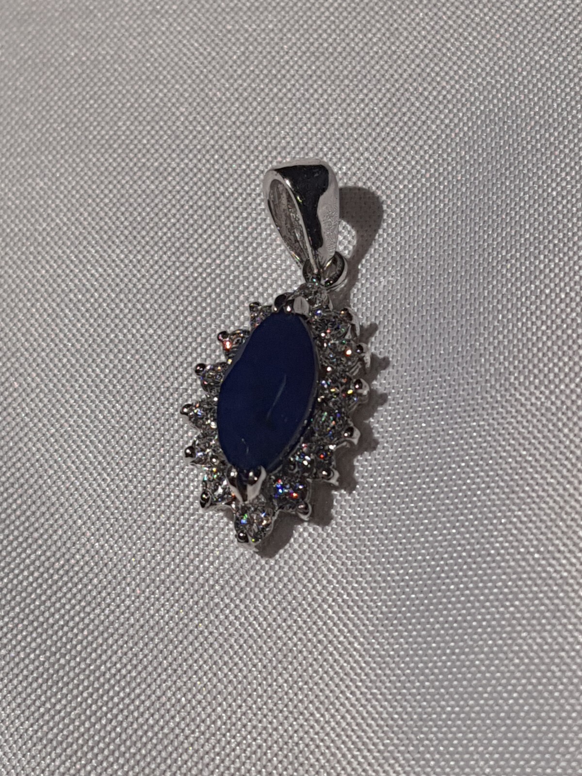 GIA Certified Natural Blue Sapphire heated with near colorless brilliants